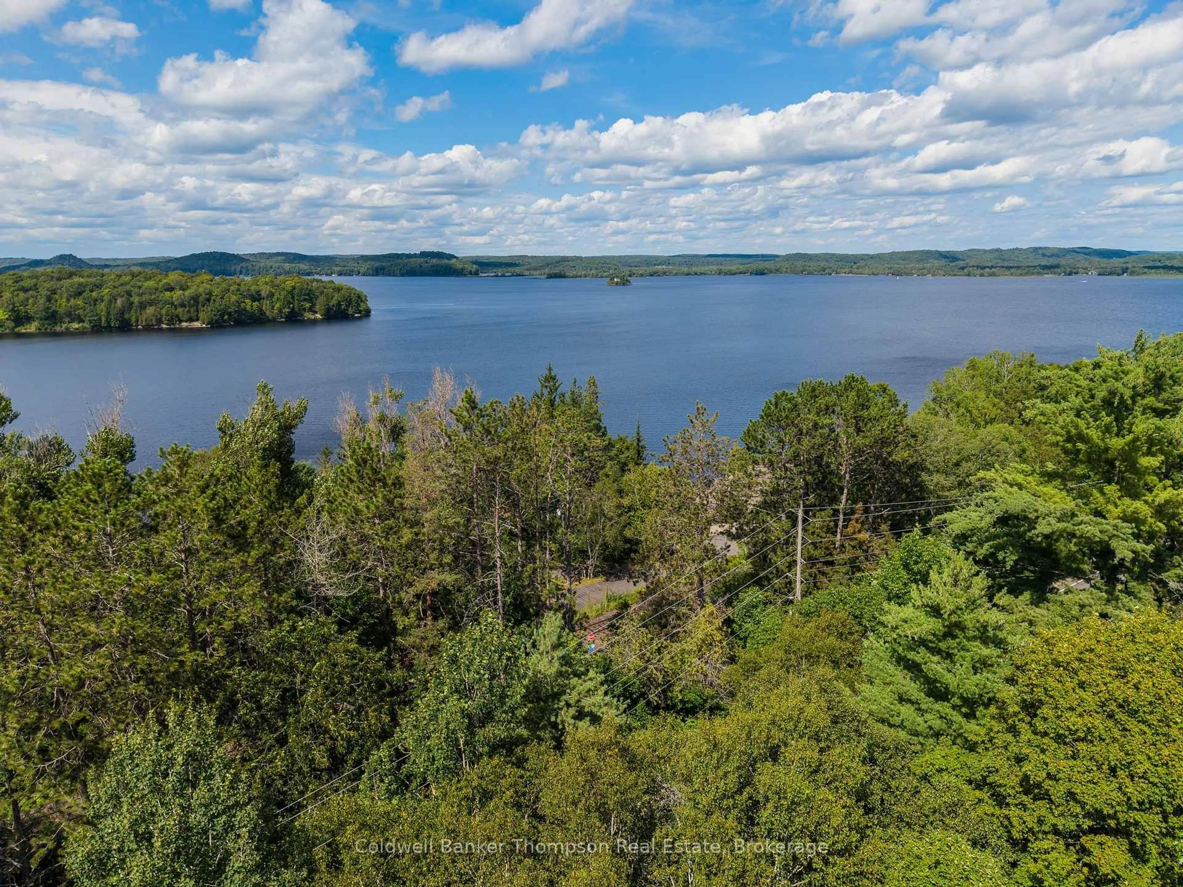 A pic from outside/outdoor area/front of a property/back of a property/a pic from drone, water/lake/river/ocean view for 935 Aspdin Rd, Huntsville Ontario P1H 2J2