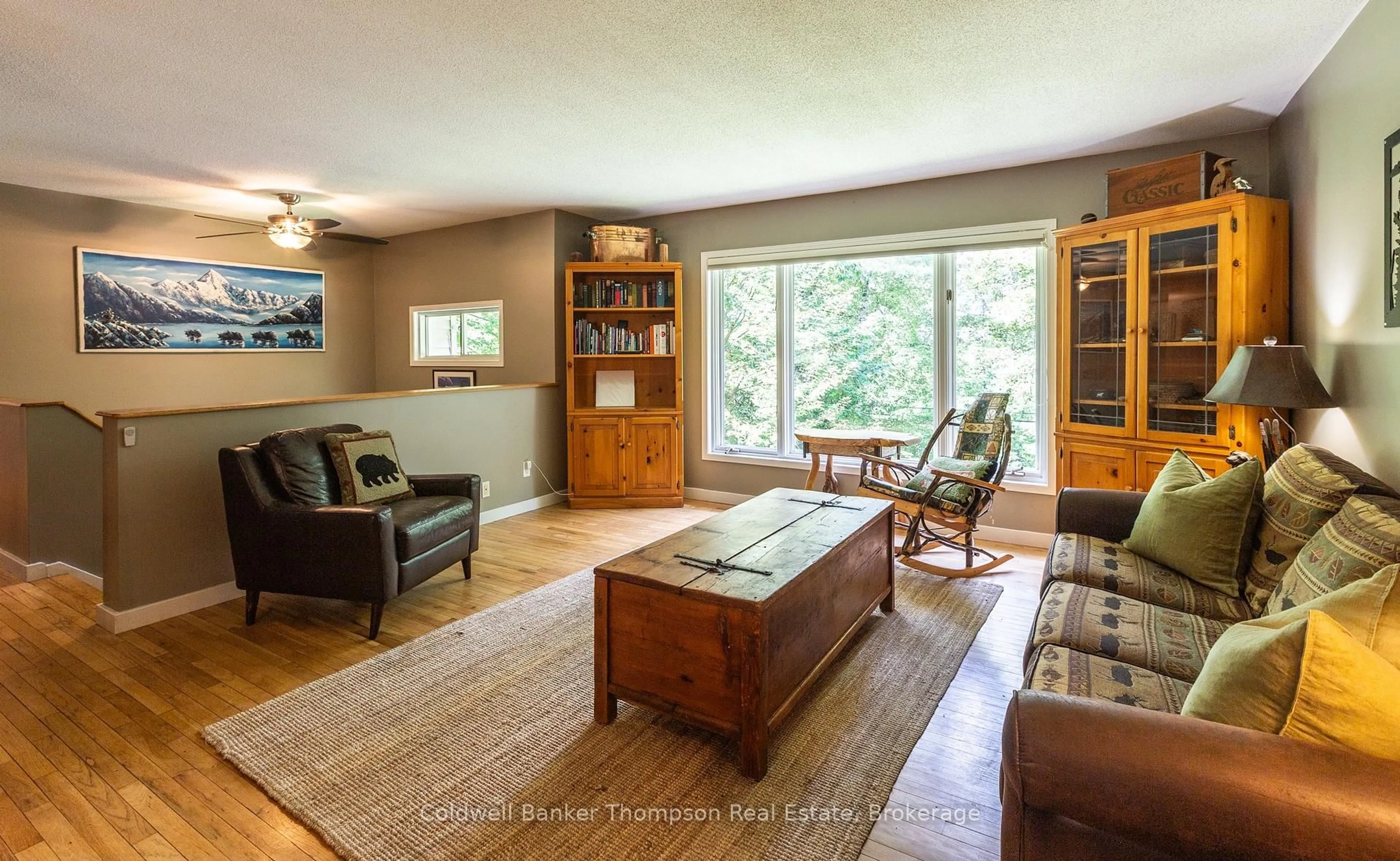 Living room with furniture, wood/laminate floor for 935 Aspdin Rd, Huntsville Ontario P1H 2J2