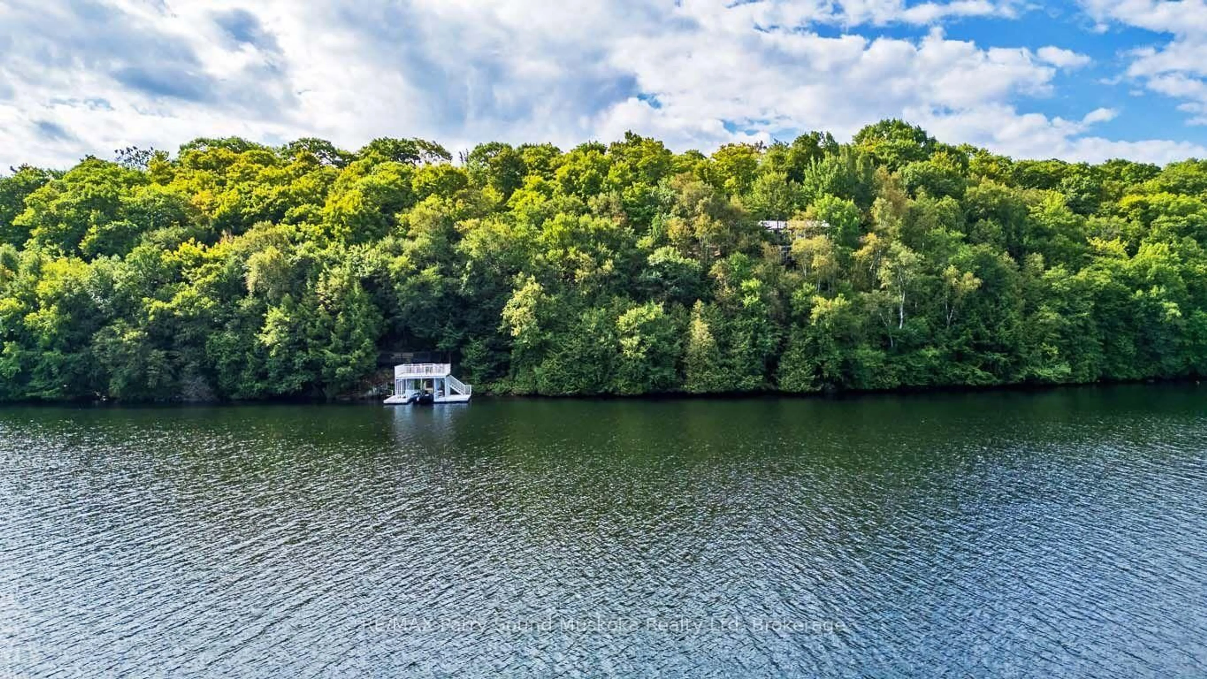 A pic from outside/outdoor area/front of a property/back of a property/a pic from drone, water/lake/river/ocean view for 56 Second Line, Seguin Ontario P2A 2W8
