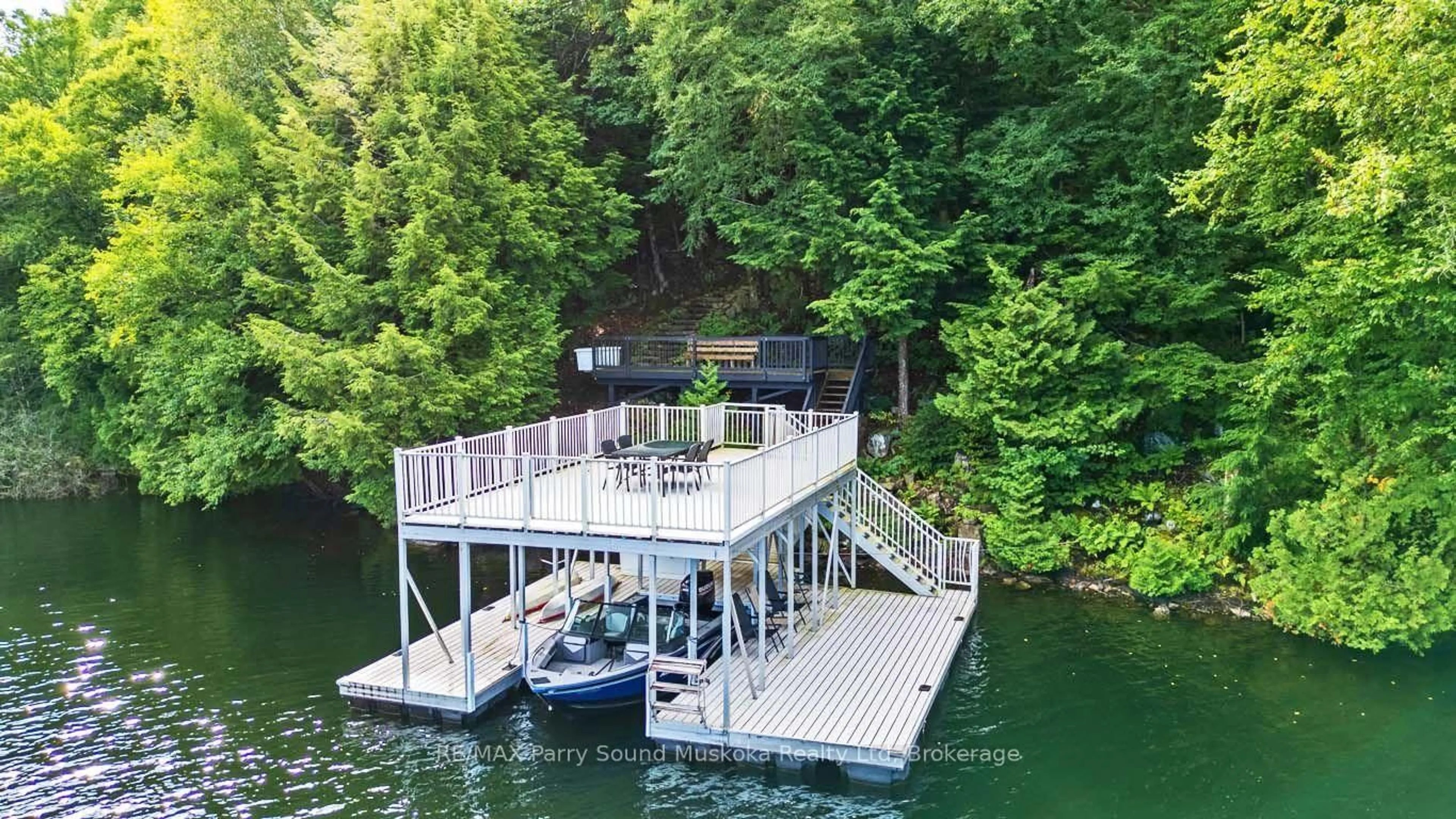 A pic from outside/outdoor area/front of a property/back of a property/a pic from drone, water/lake/river/ocean view for 56 Second Line, Seguin Ontario P2A 2W8