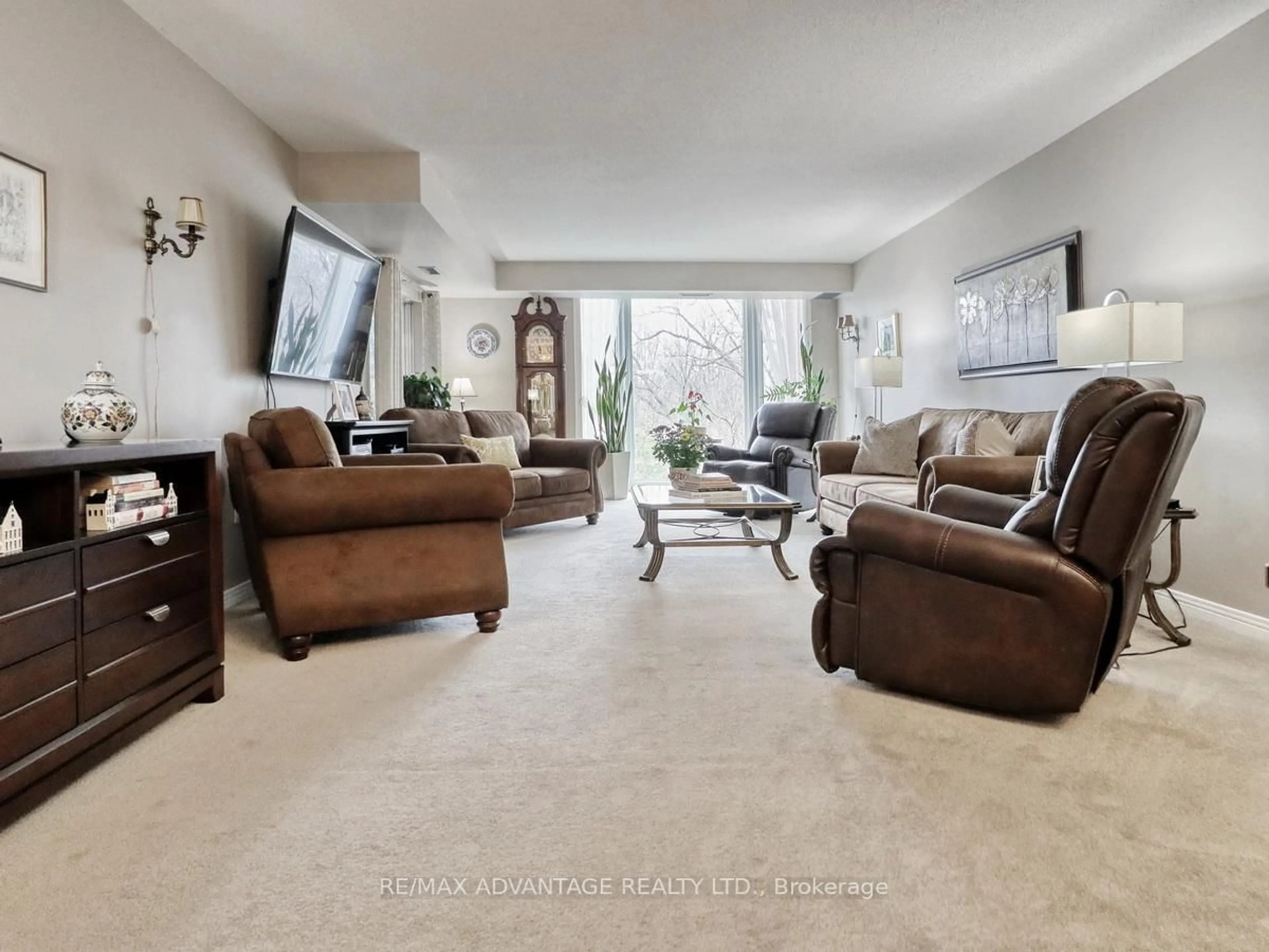 Living room with furniture, unknown for 693 Windermere Rd #307, London North Ontario N5X 2P1