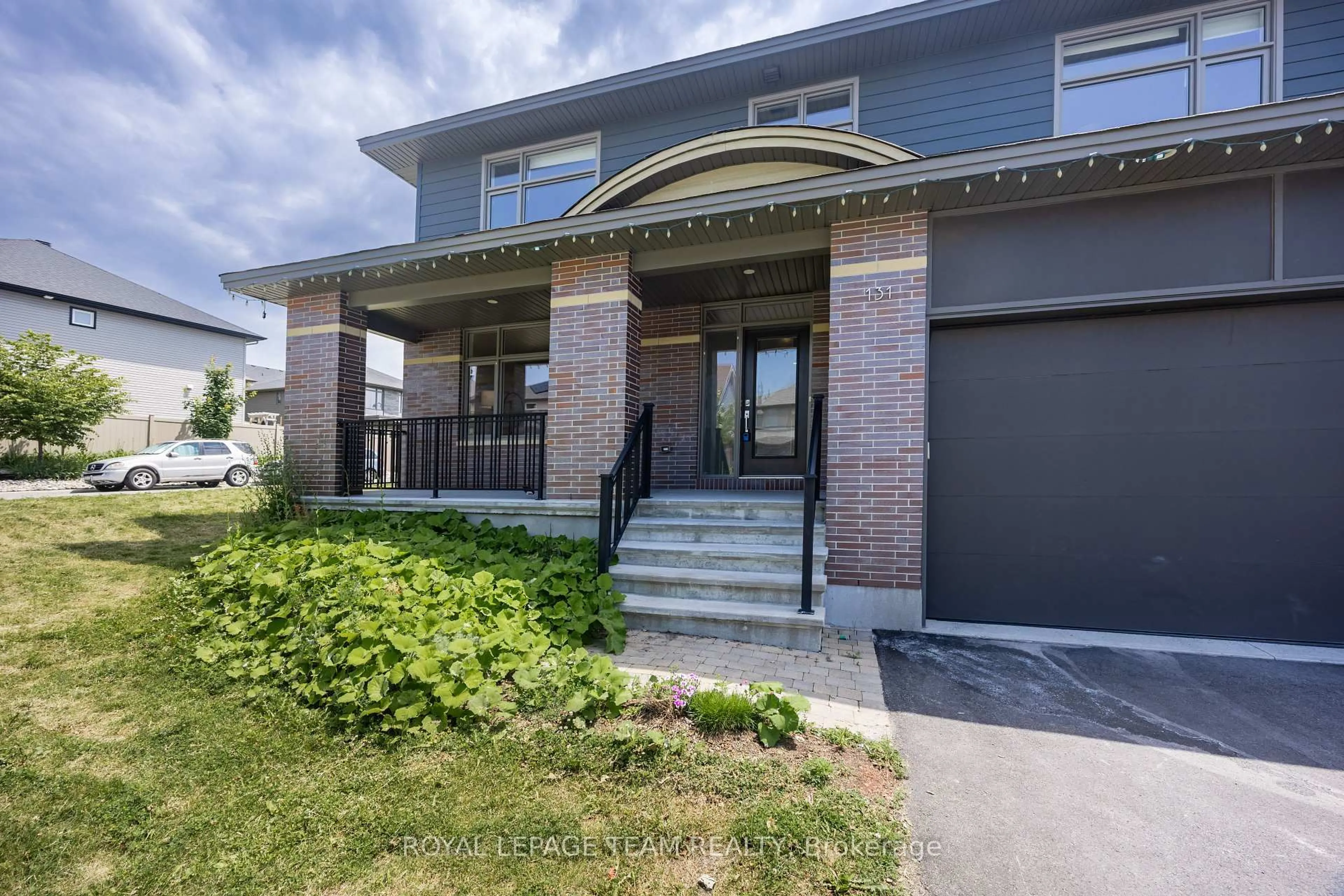 Home with brick exterior material, street for 131 Escarpment Cres, Ottawa Ontario K2T 0L8