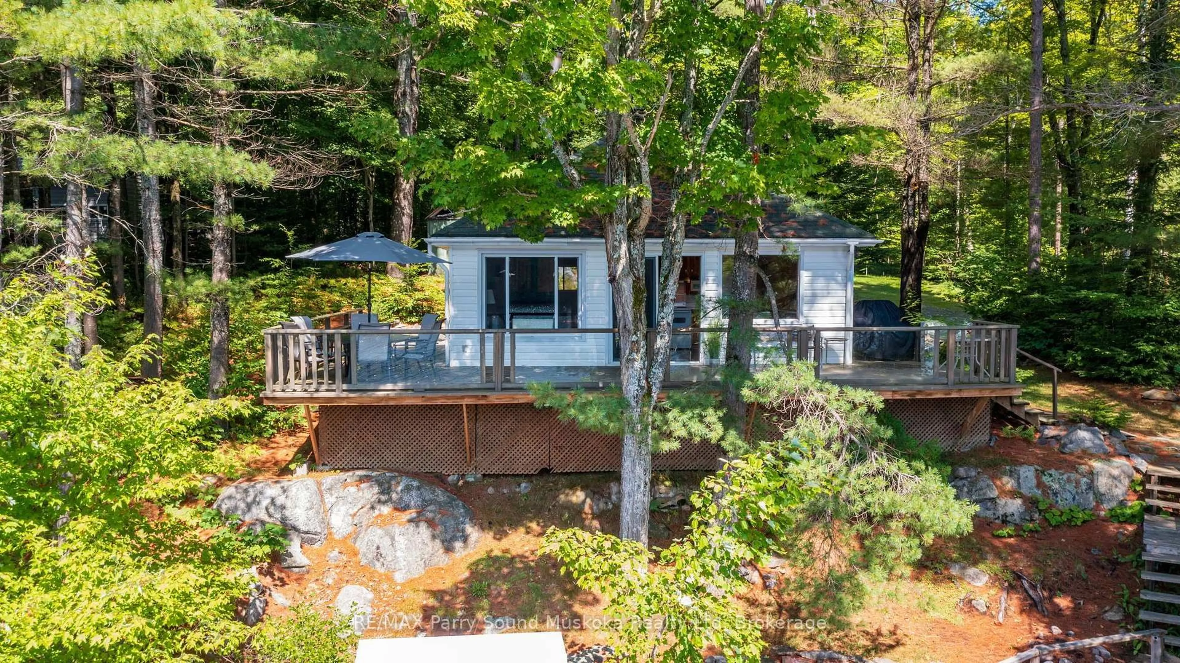 A pic from outside/outdoor area/front of a property/back of a property/a pic from drone, water/lake/river/ocean view for 4 Post Lane, Seguin Ontario P2A 2W8