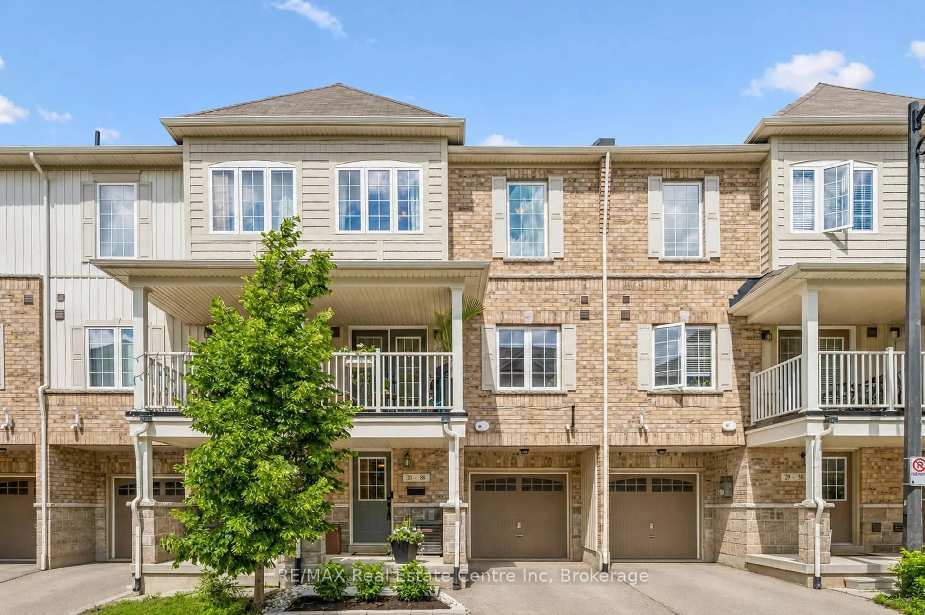 A pic from outside/outdoor area/front of a property/back of a property/a pic from drone, street for 88 DECORSO Dr #30, Guelph Ontario N1L 0A1
