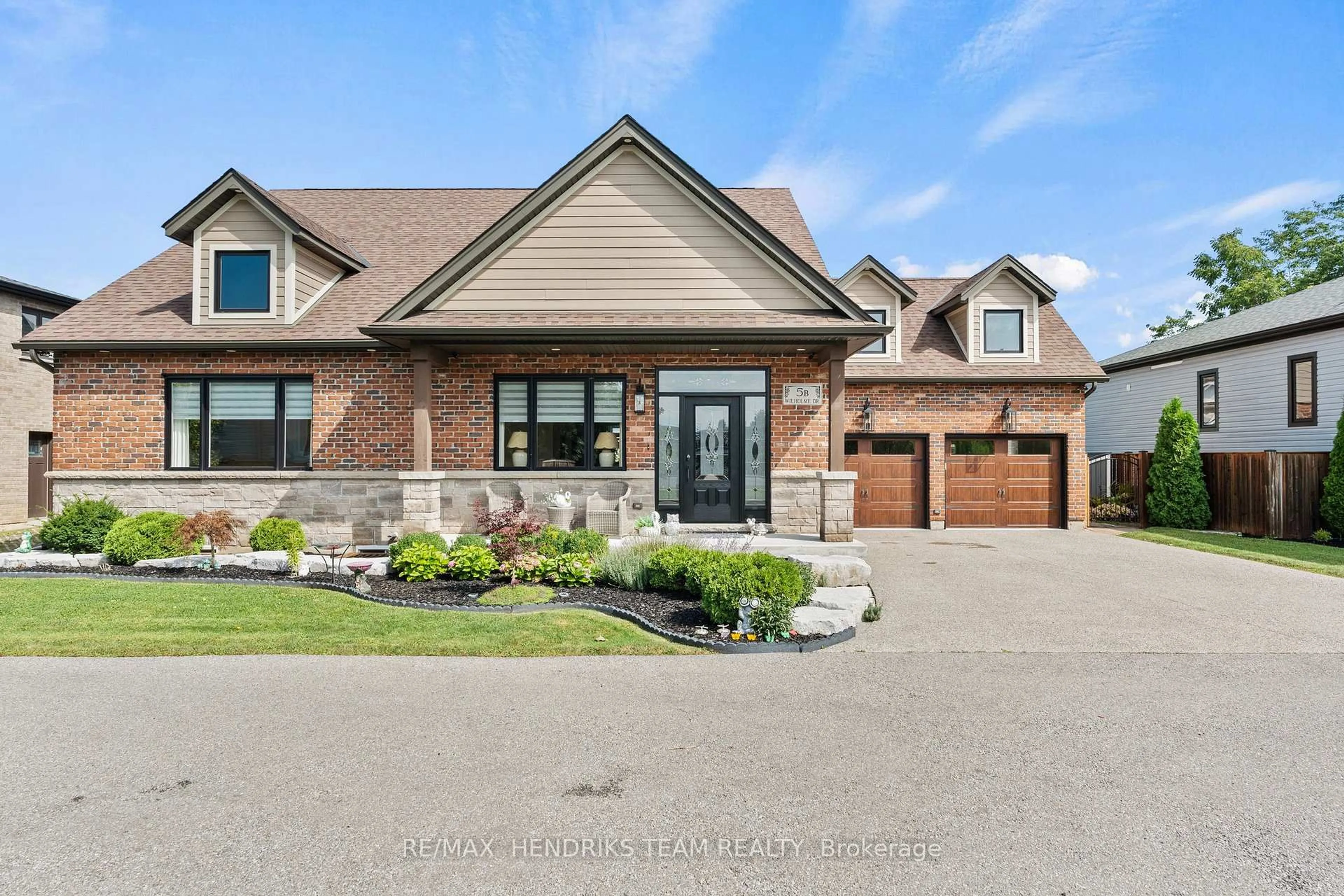 Home with brick exterior material, street for 5B Wilholme Dr, St. Catharines Ontario L2W 1B9