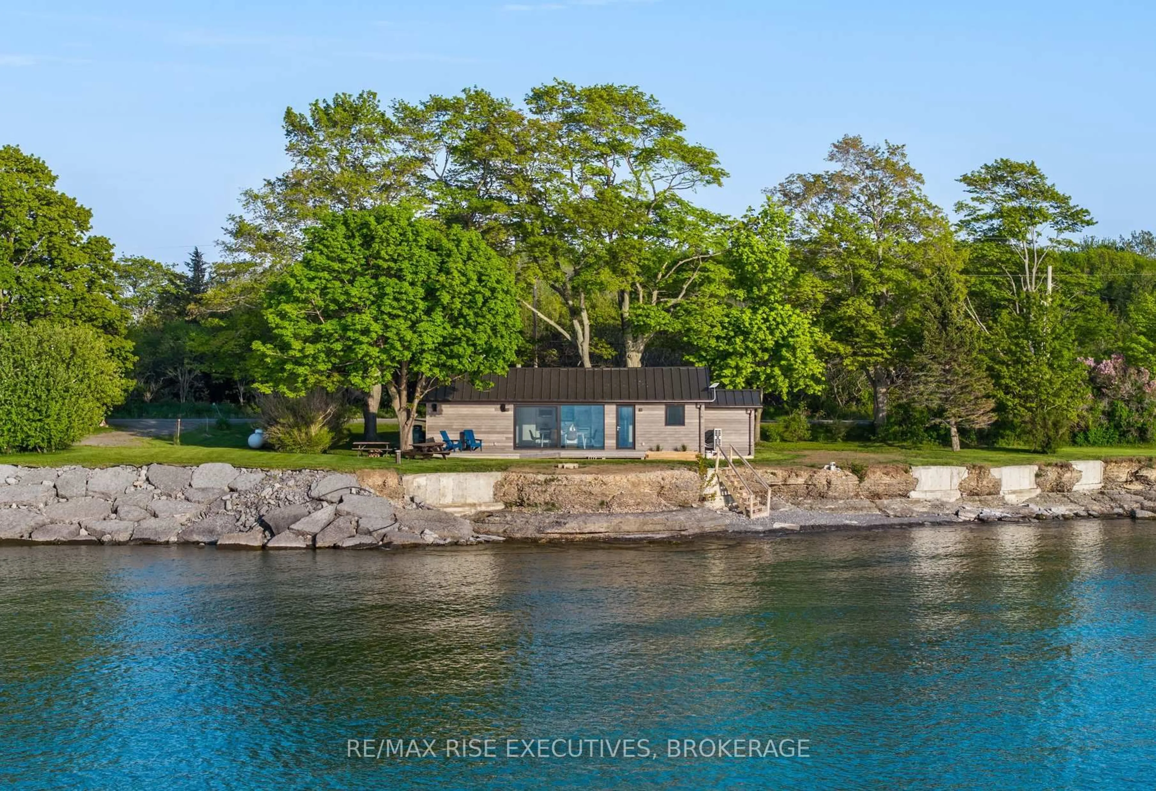 A pic from outside/outdoor area/front of a property/back of a property/a pic from drone, water/lake/river/ocean view for 682 Salmon Point Rd, Prince Edward County Ontario K0K 1P0