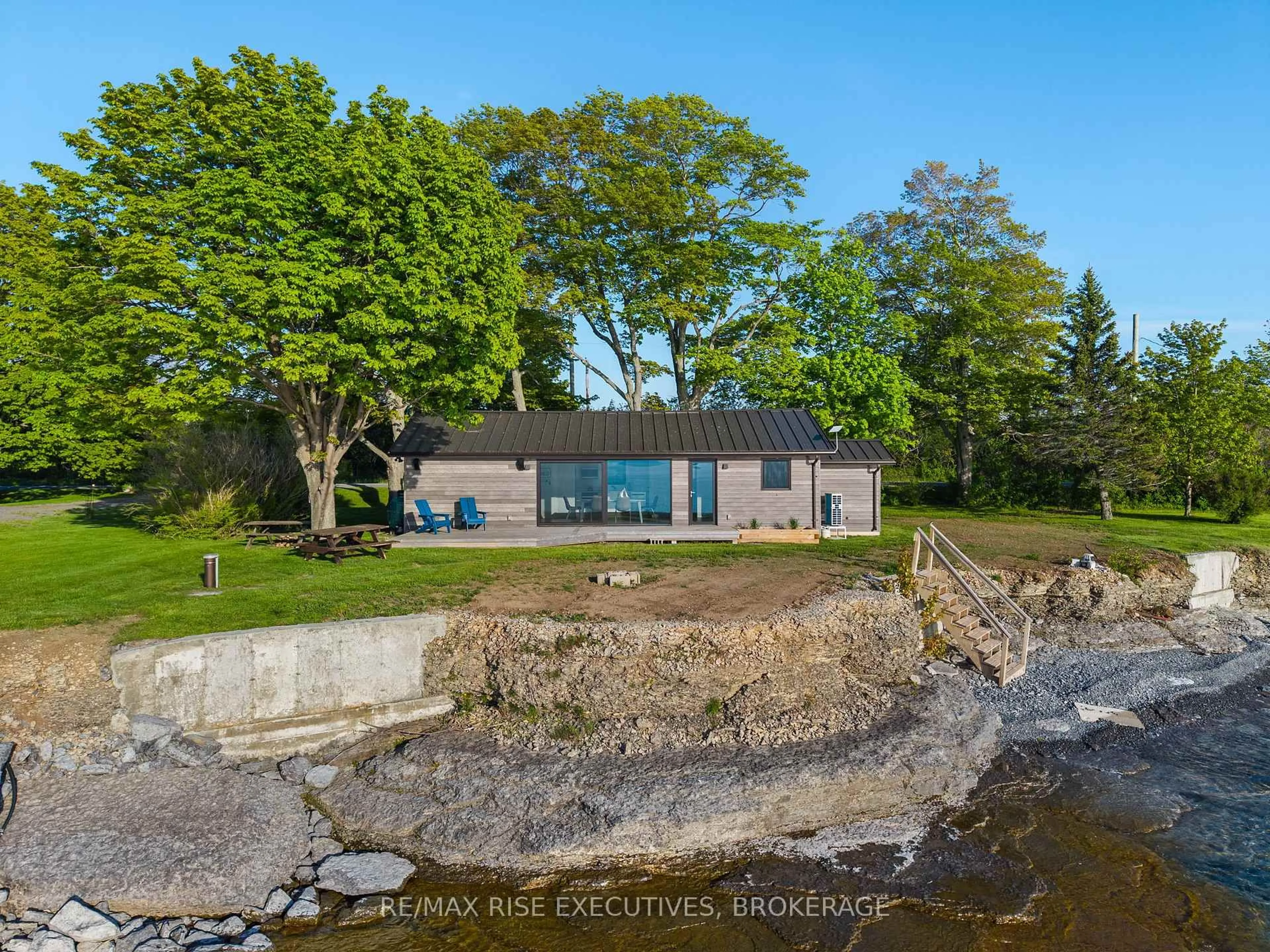 A pic from outside/outdoor area/front of a property/back of a property/a pic from drone, water/lake/river/ocean view for 682 Salmon Point Rd, Prince Edward County Ontario K0K 1P0