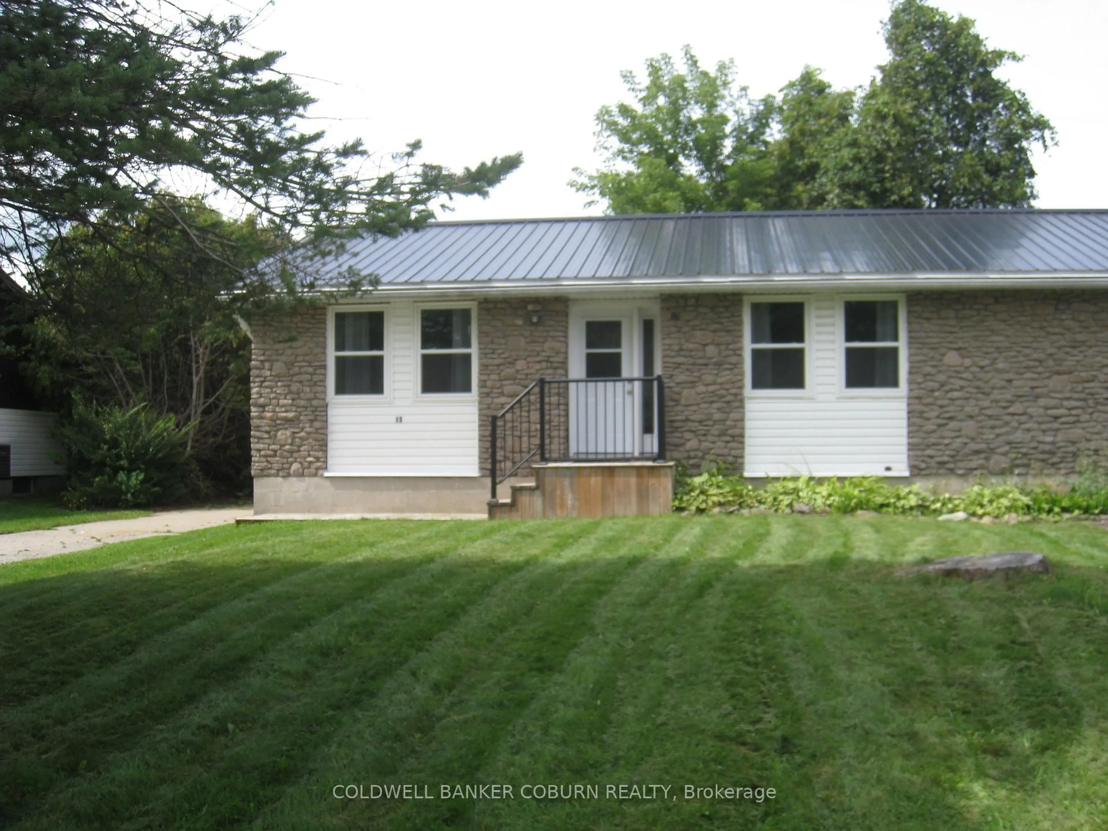 Home with vinyl exterior material, street for 13 Queen St, North Grenville Ontario K0G 1J0