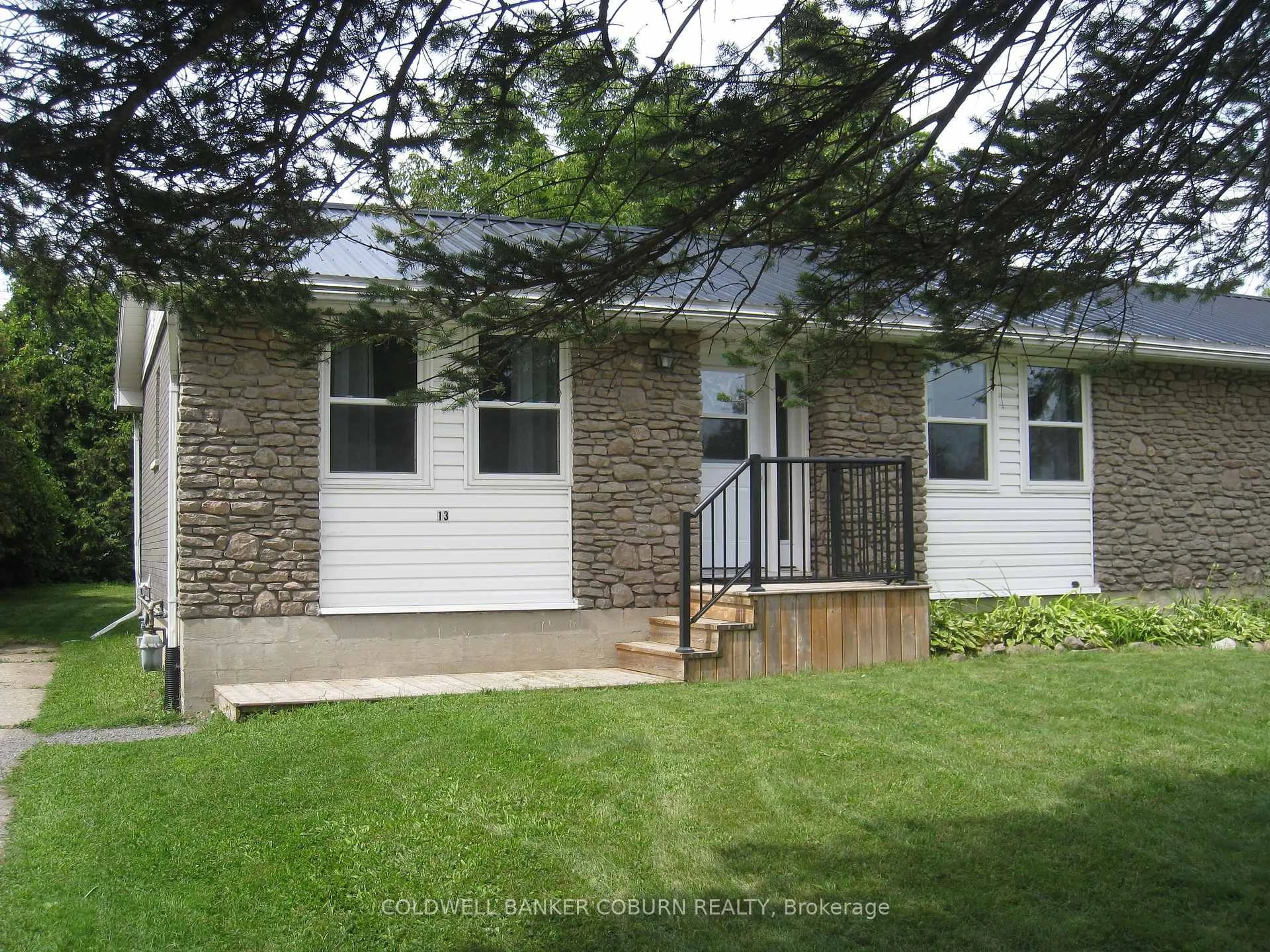 Home with vinyl exterior material, street for 13 Queen St, North Grenville Ontario K0G 1J0