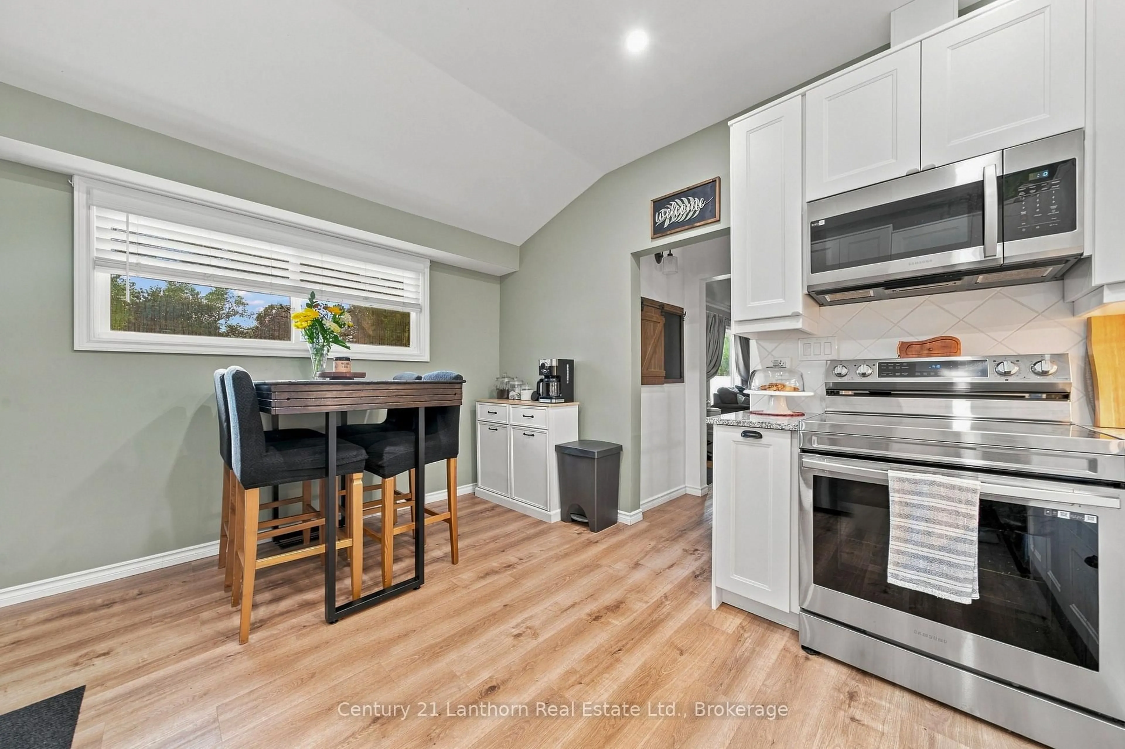 Open concept kitchen, wood/laminate floor for 169 Farley Ave, Belleville Ontario K8N 4L3
