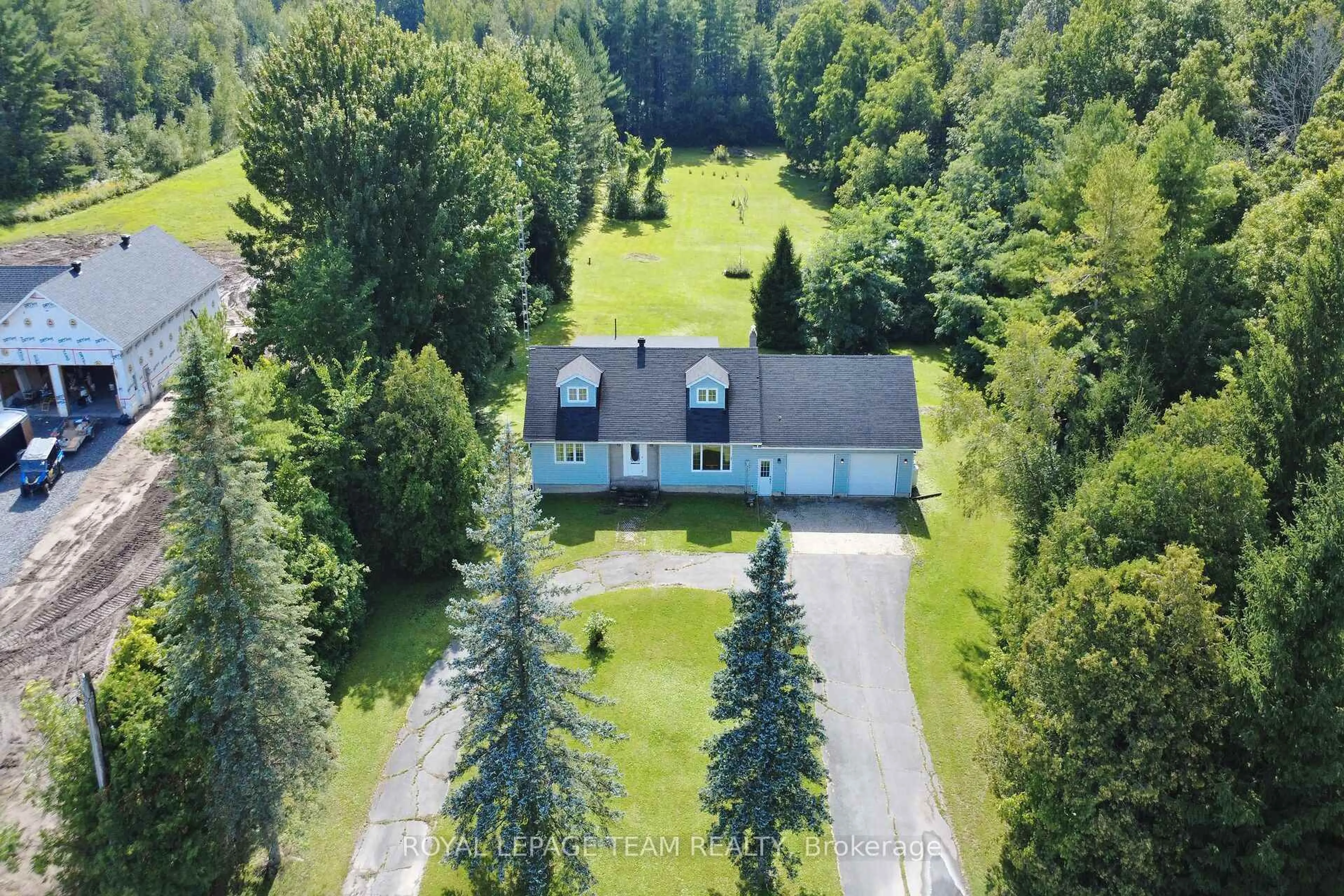 A pic from outside/outdoor area/front of a property/back of a property/a pic from drone, forest/trees view for 3246 Tolmies Corners Rd, North Stormont Ontario K0C 1C0