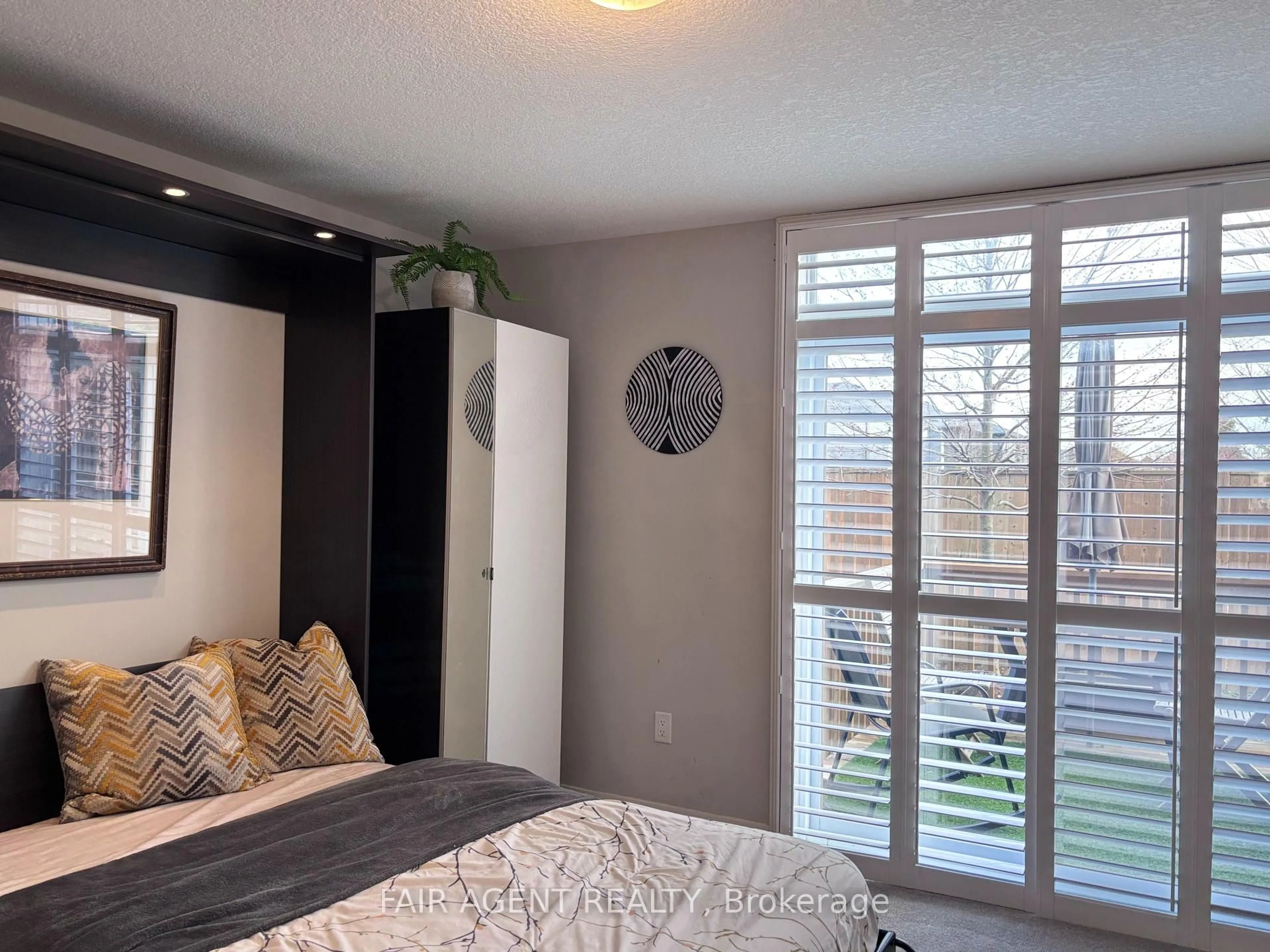 Bedroom with bed, wood/laminate floor for 1960 DALMAGARRY Rd #228, London North Ontario N6G 0T8