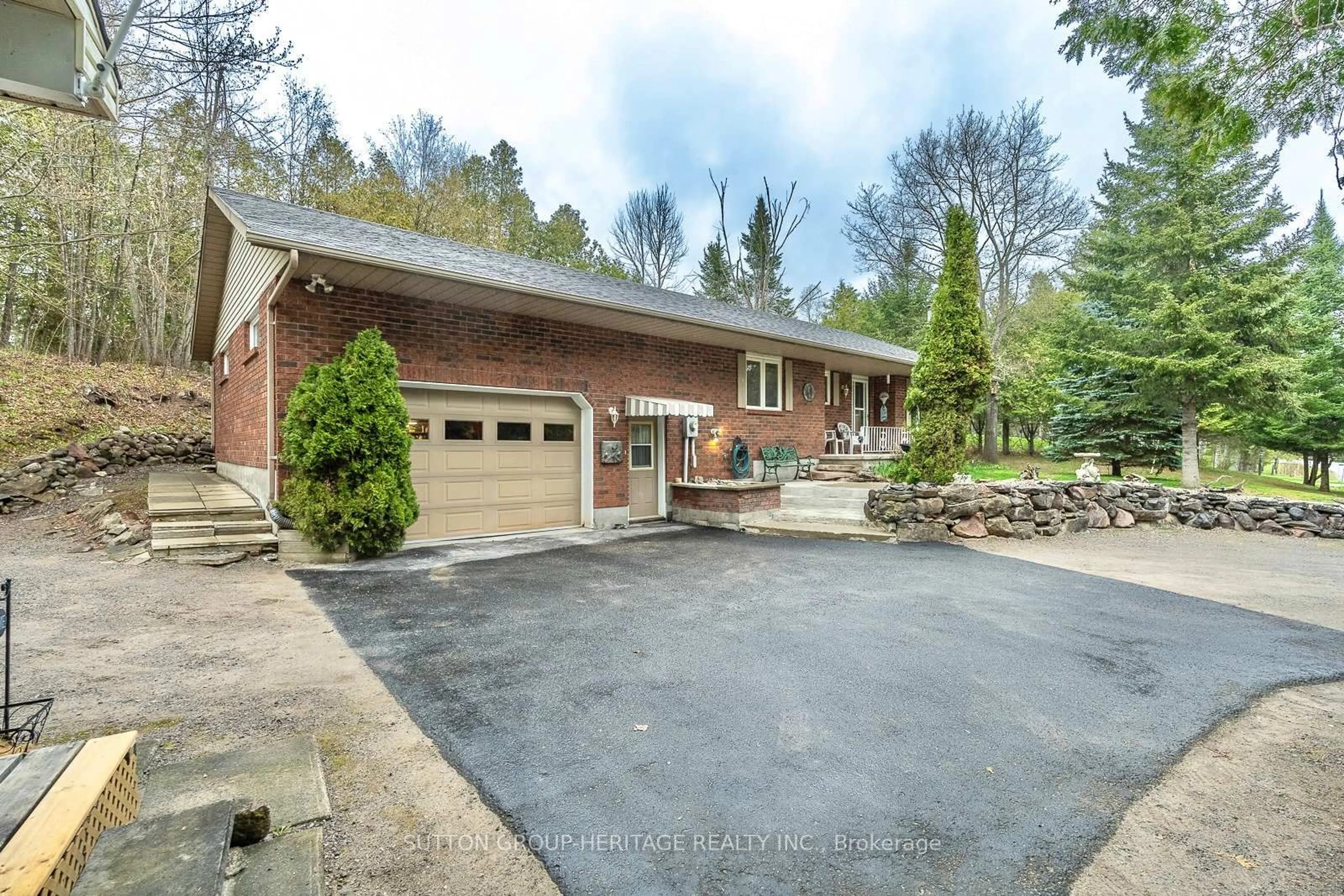 A pic from outside/outdoor area/front of a property/back of a property/a pic from drone, street for 228 Pirates Glen Dr, Trent Lakes Ontario K0M 1A0