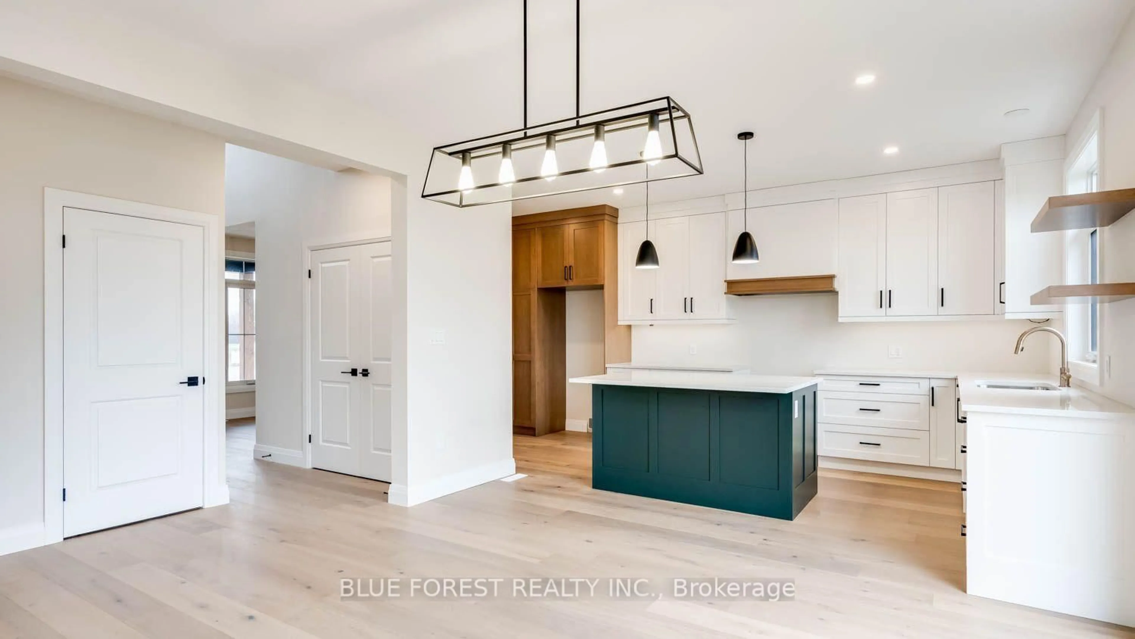 Open concept kitchen, wood/laminate floor for 274 Harvest Lane, Thames Centre Ontario N0L 1G2