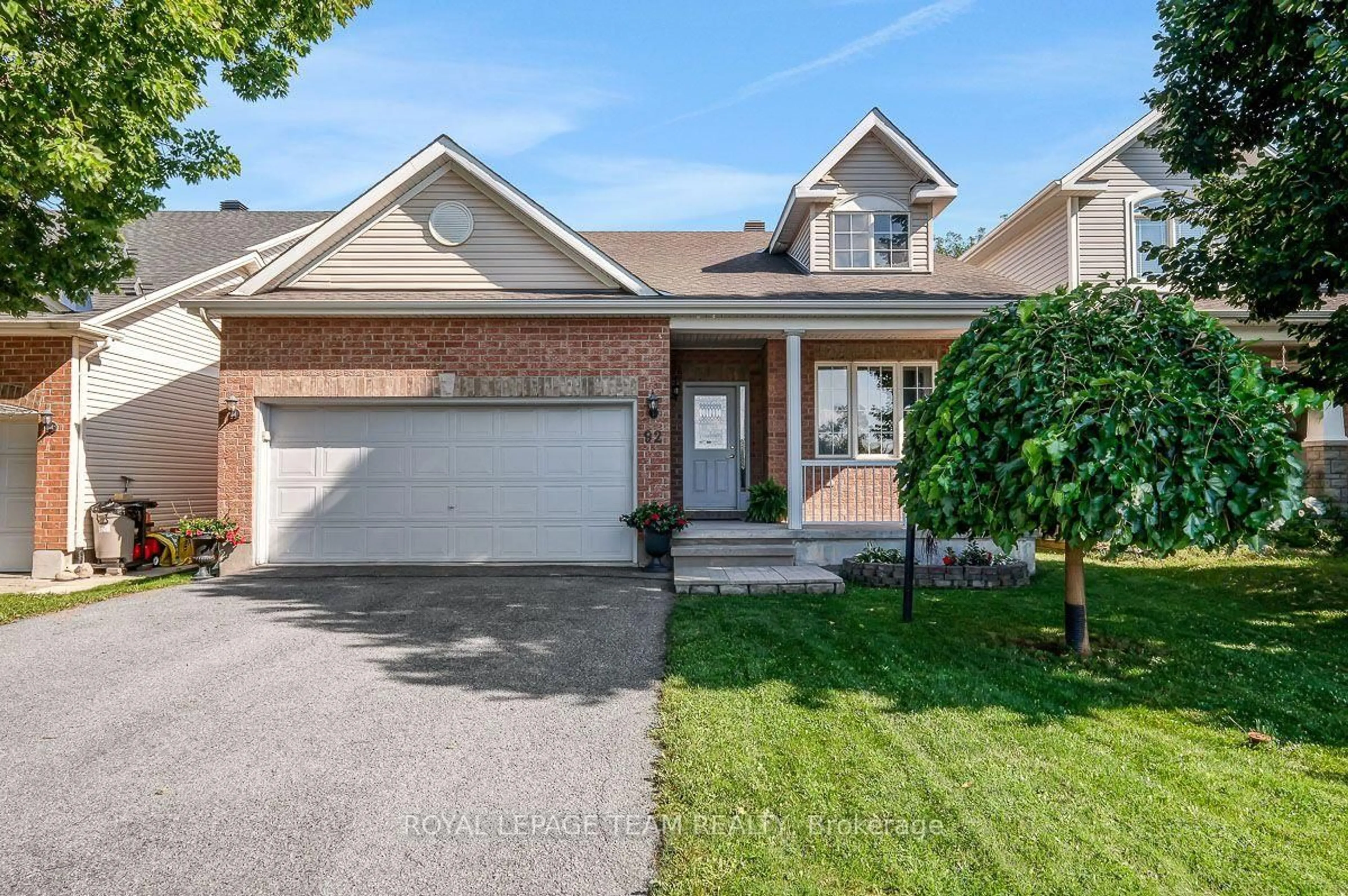 Home with brick exterior material, street for 92 Hartsmere Dr, Ottawa Ontario K2S 2B7