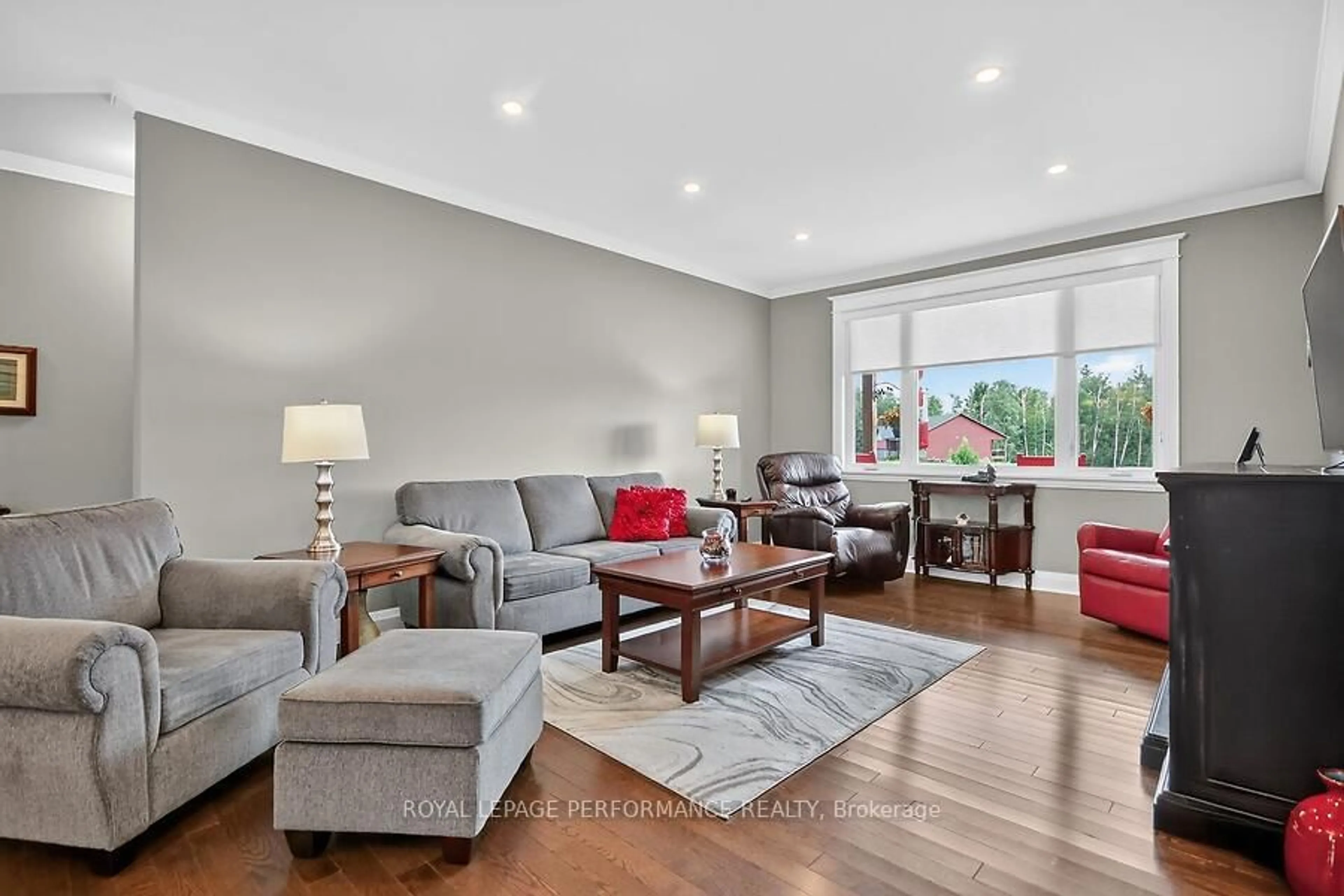 Living room with furniture, wood/laminate floor for 118 Stirling Cres, North Grenville Ontario K0G 1J0
