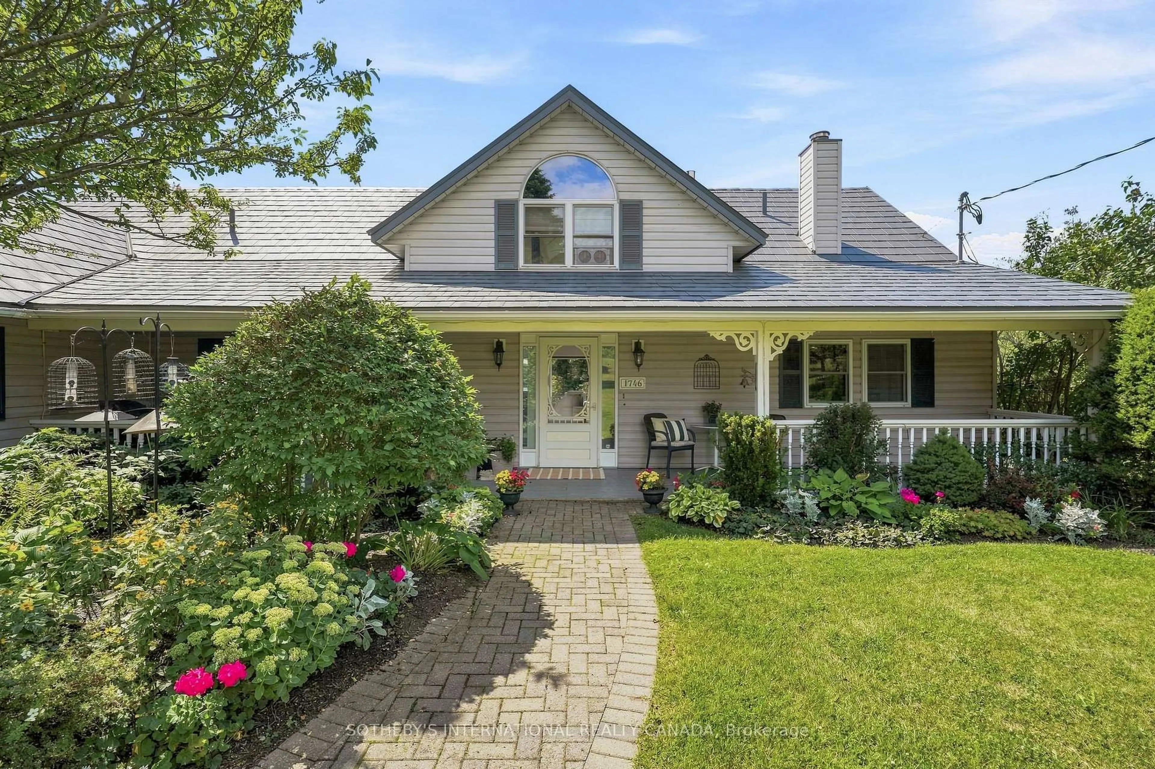Home with vinyl exterior material, street for 1746 Old Milford Rd, Prince Edward County Ontario K0K 2P0