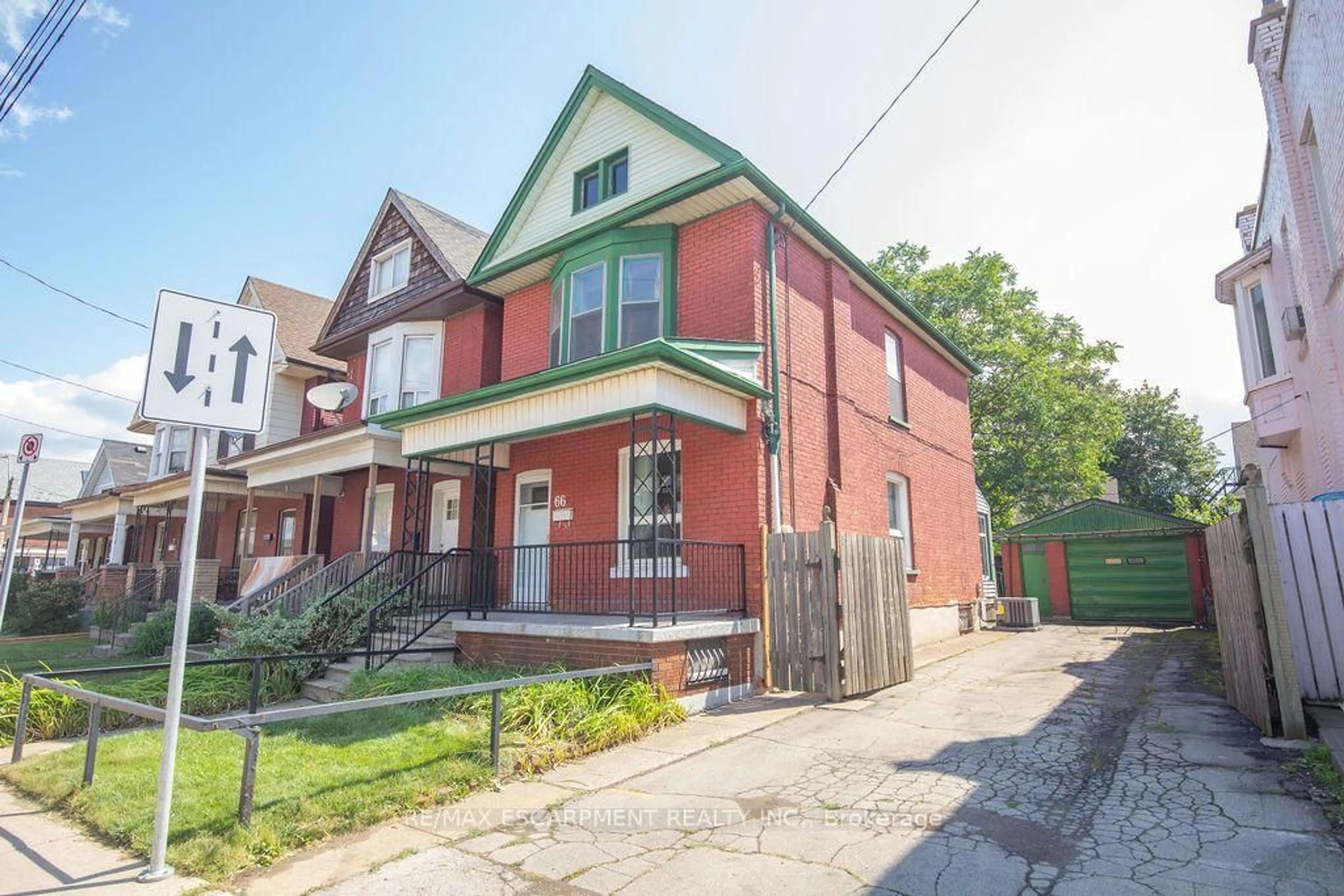 Home with brick exterior material, street for 66 Sherman Ave, Hamilton Ontario L8L 6M2