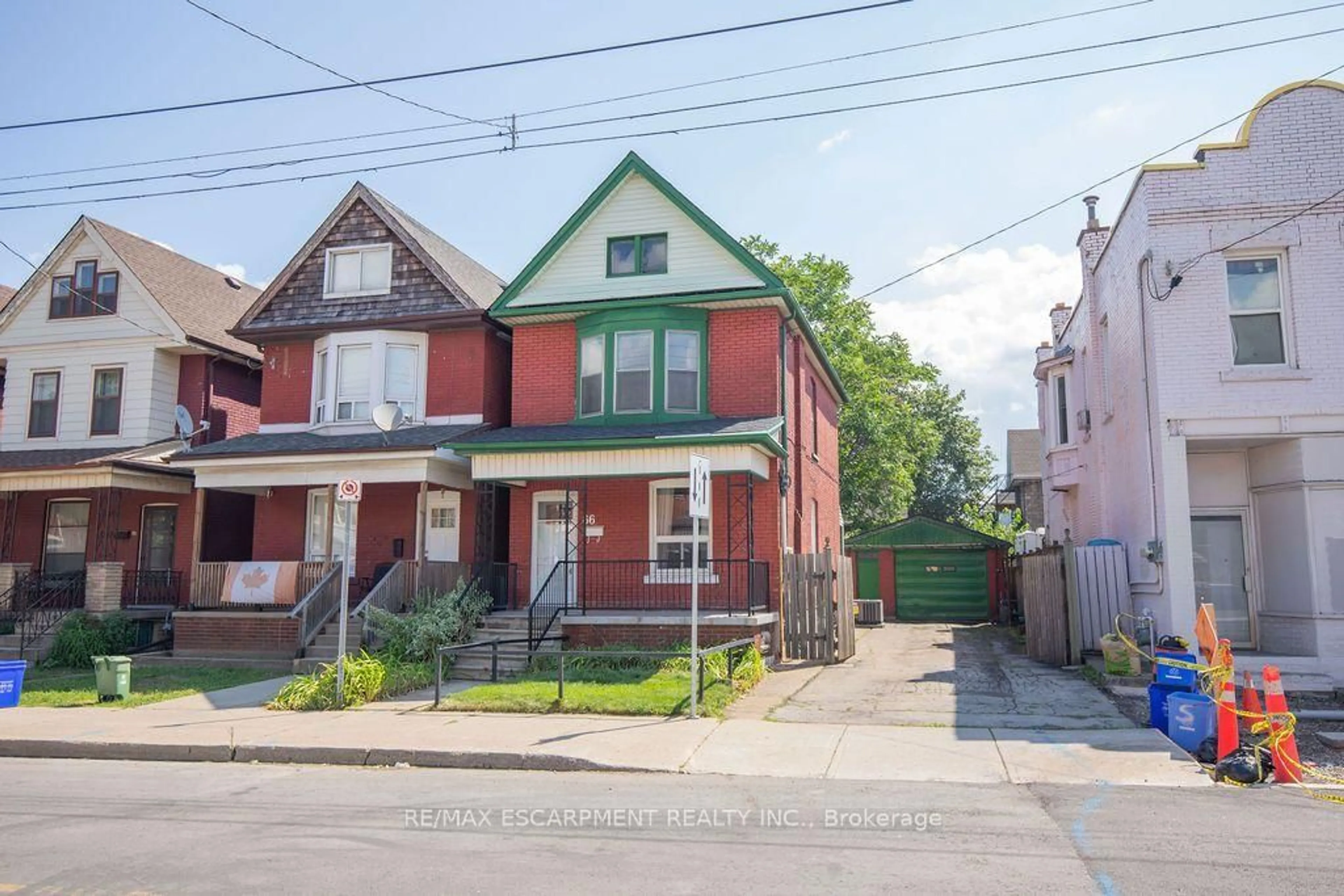 Home with brick exterior material, street for 66 Sherman Ave, Hamilton Ontario L8L 6M2
