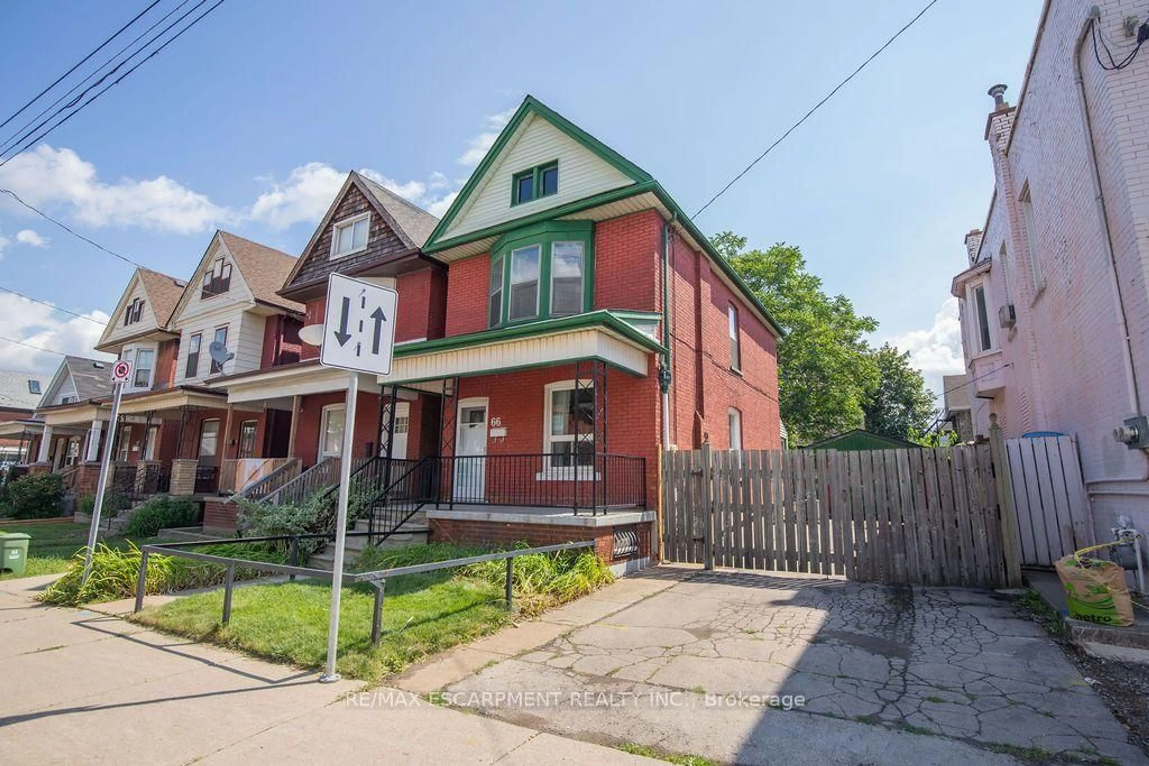 Home with brick exterior material, street for 66 Sherman Ave, Hamilton Ontario L8L 6M2