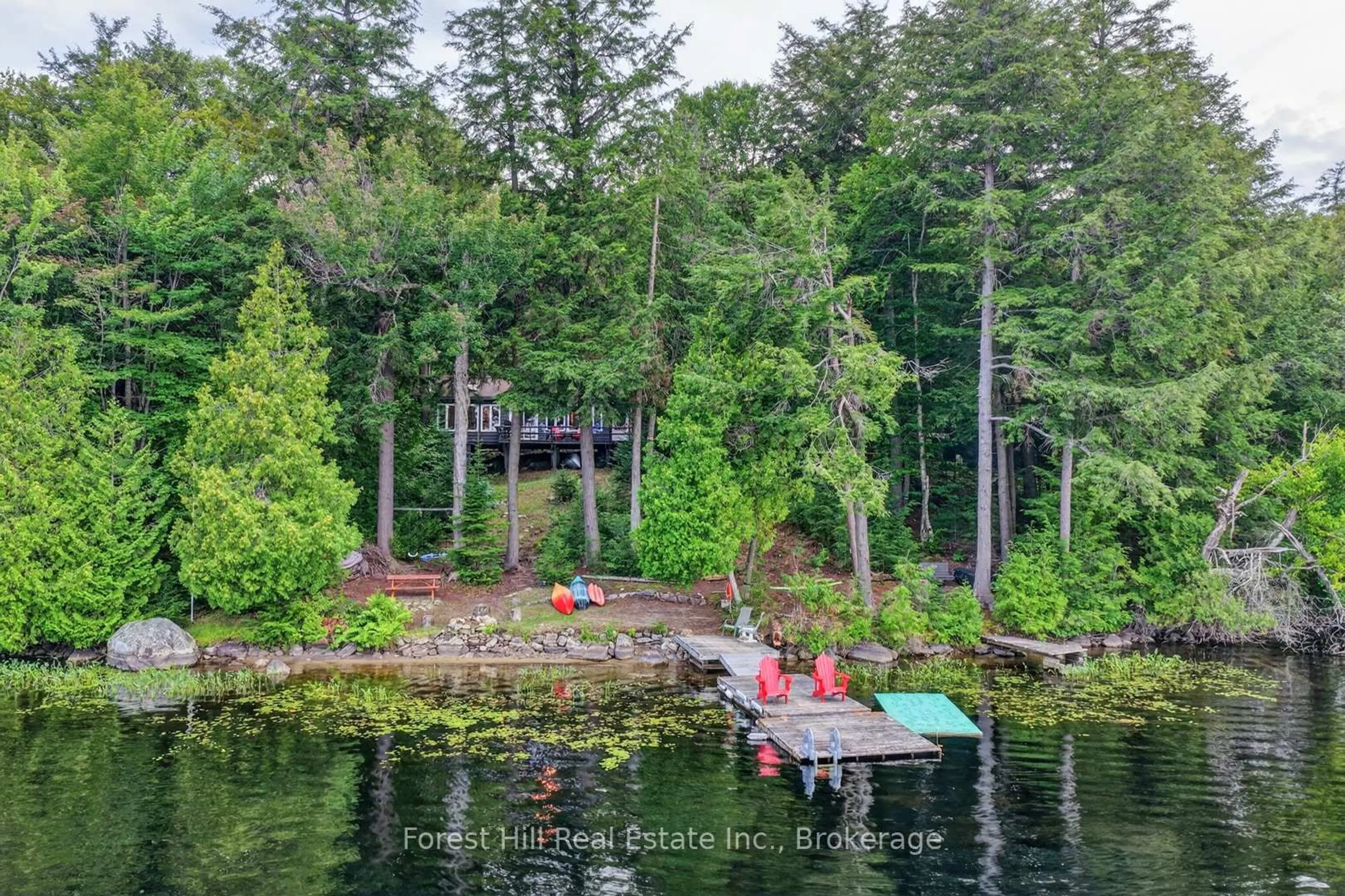 A pic from outside/outdoor area/front of a property/back of a property/a pic from drone, water/lake/river/ocean view for 1052 Skin Lake Dr, Algonquin Highlands Ontario P0A 1E0