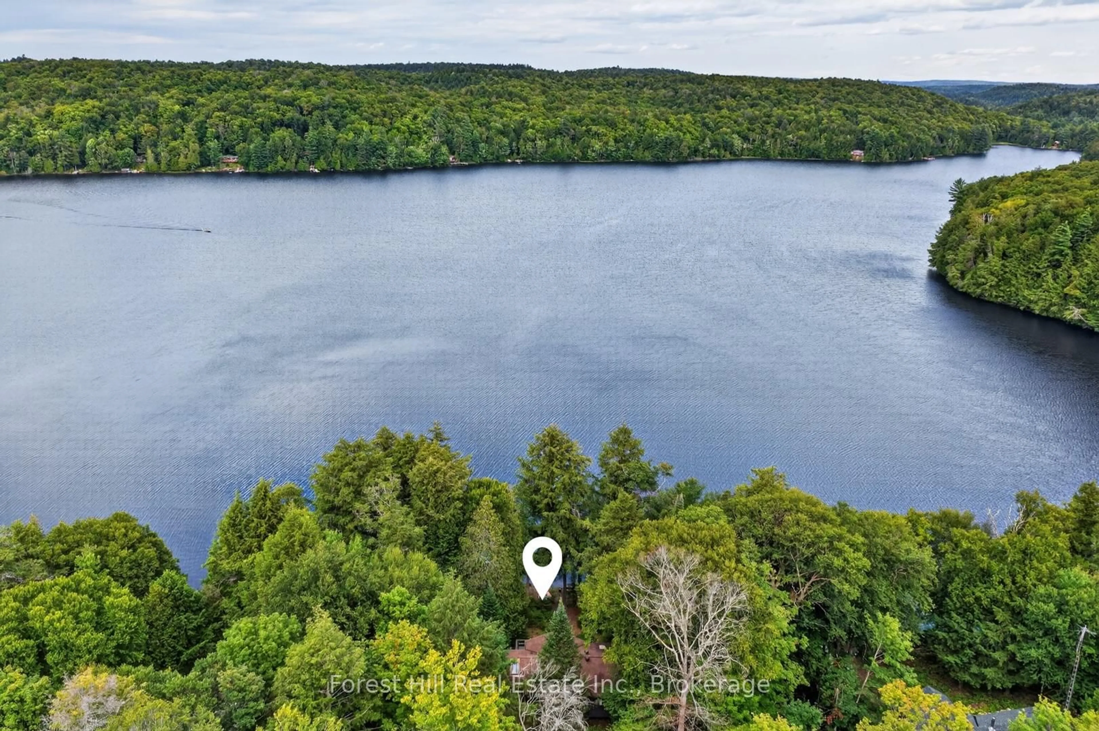 A pic from outside/outdoor area/front of a property/back of a property/a pic from drone, water/lake/river/ocean view for 1052 Skin Lake Dr, Algonquin Highlands Ontario P0A 1E0