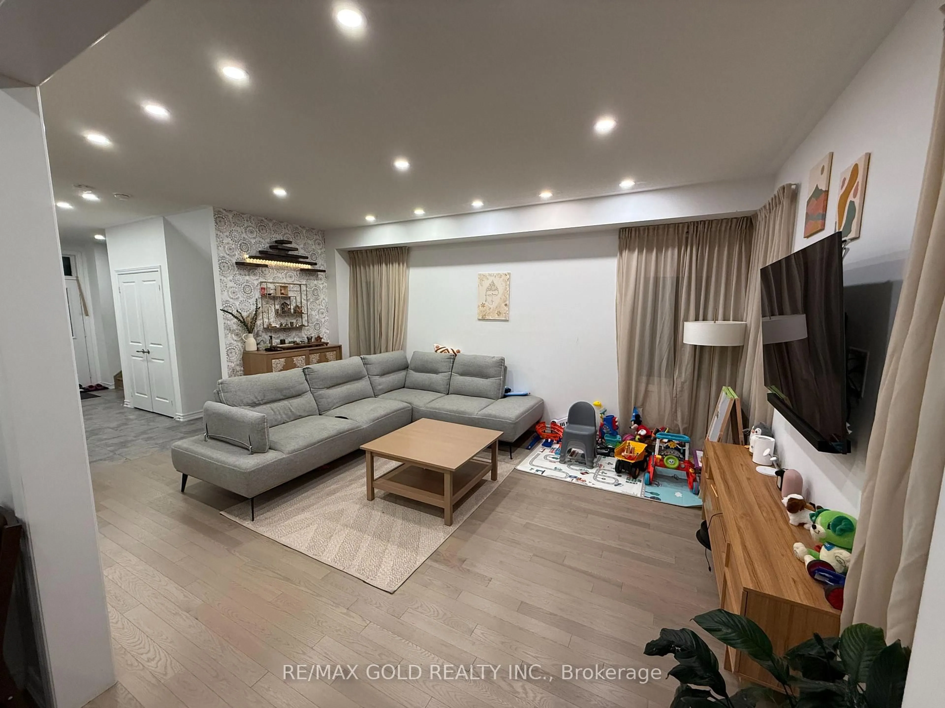 Living room with furniture, wood/laminate floor for 20 Corbett St, Southgate Ontario N0C 1B0