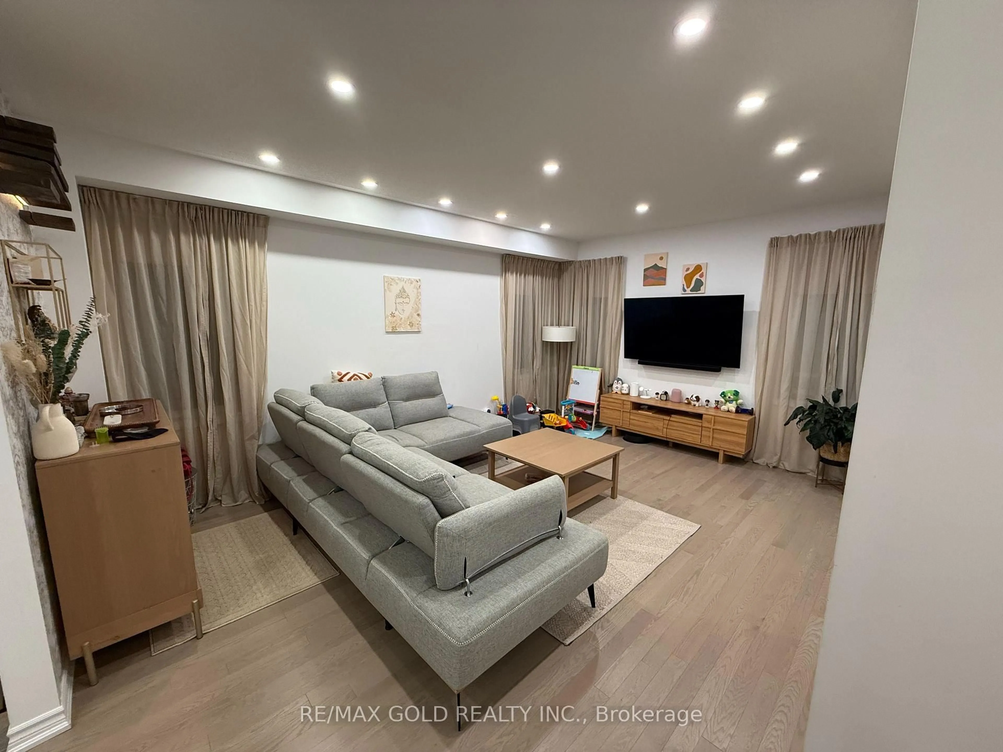 Living room with furniture, wood/laminate floor for 20 Corbett St, Southgate Ontario N0C 1B0