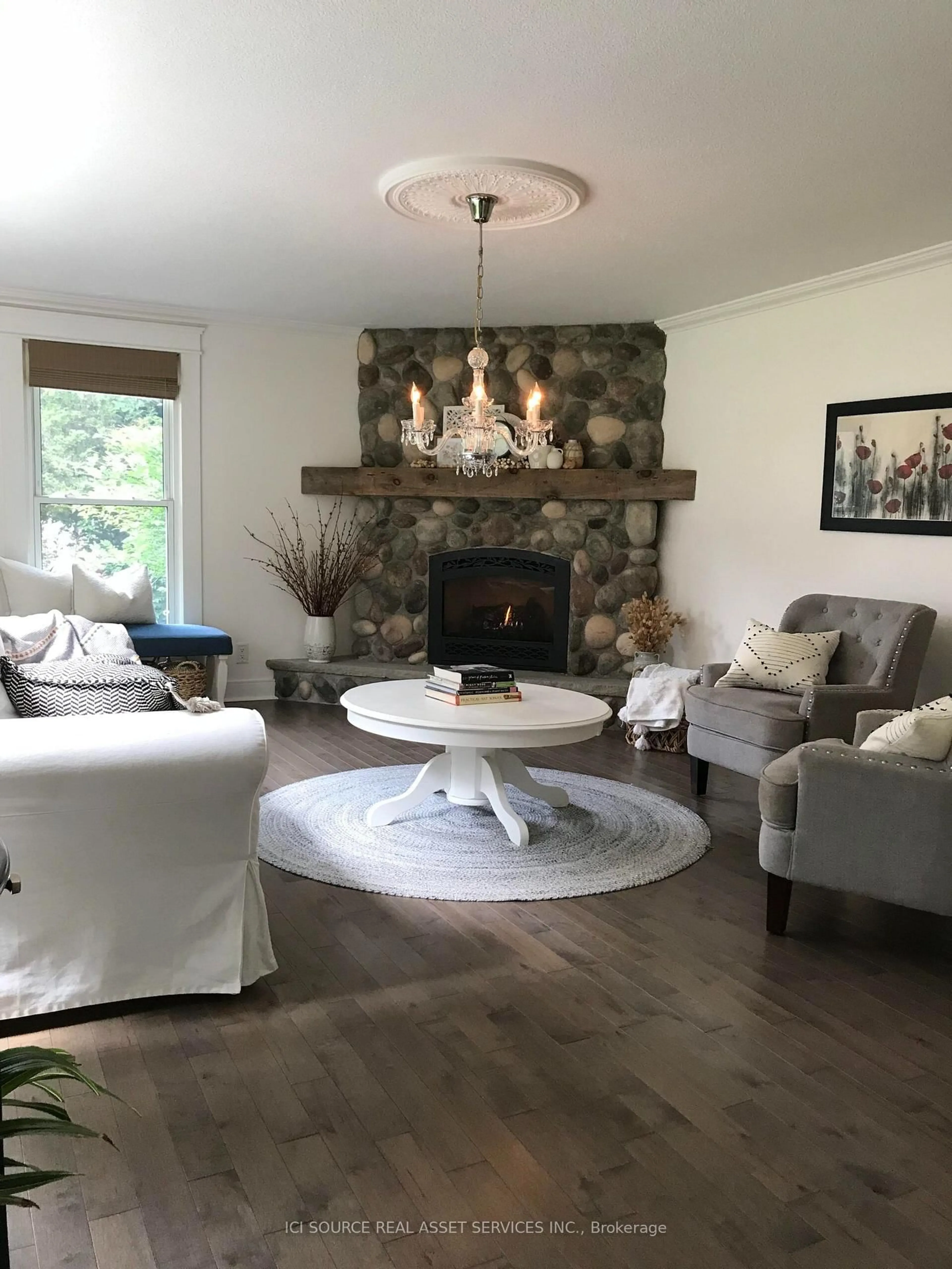 Living room with furniture, wood/laminate floor for 8768 Park St, Lambton Shores Ontario N0N 1J7