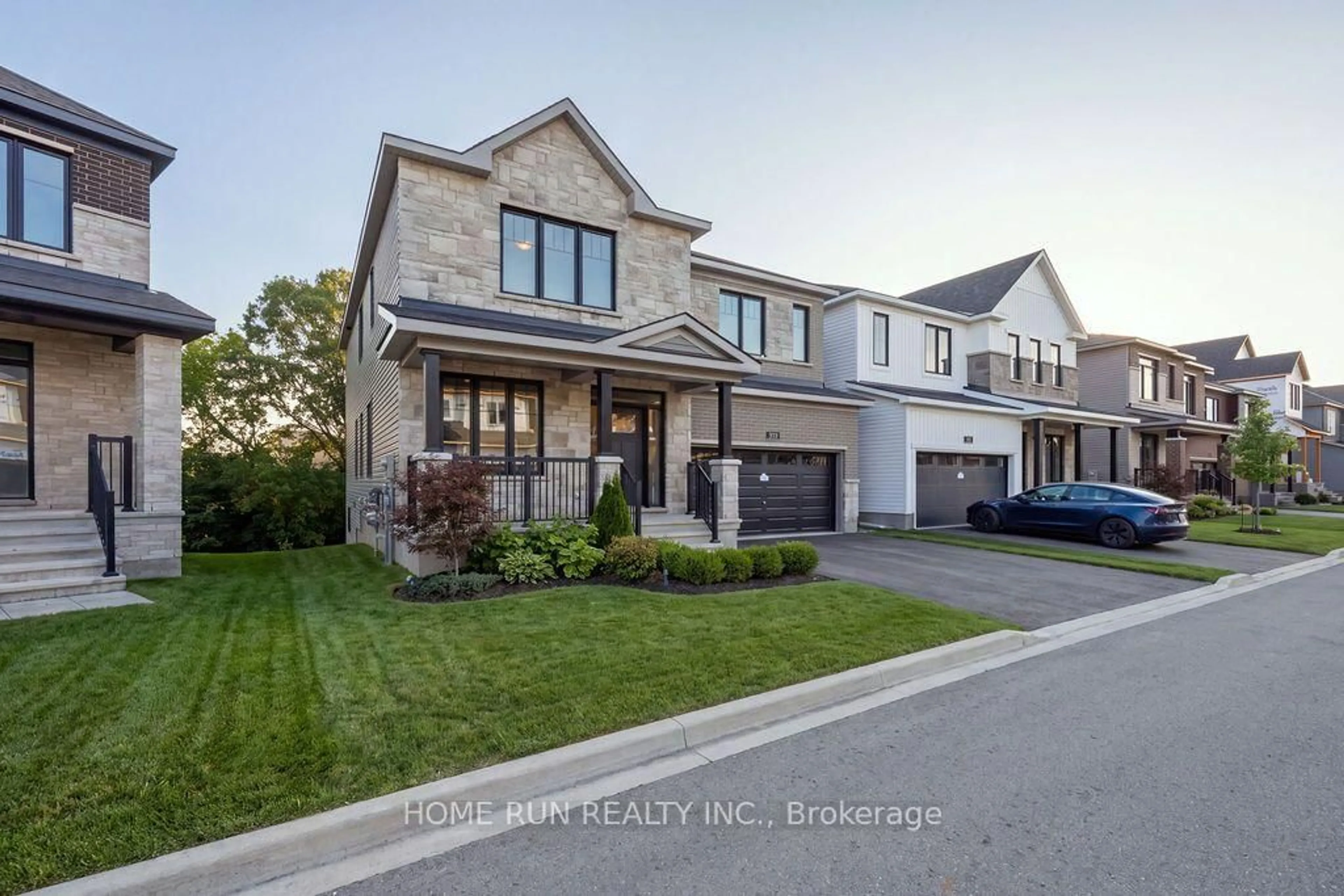 Home with brick exterior material, street for 359 Vibert Douglas Dr, Kanata Ontario K2W 0M4