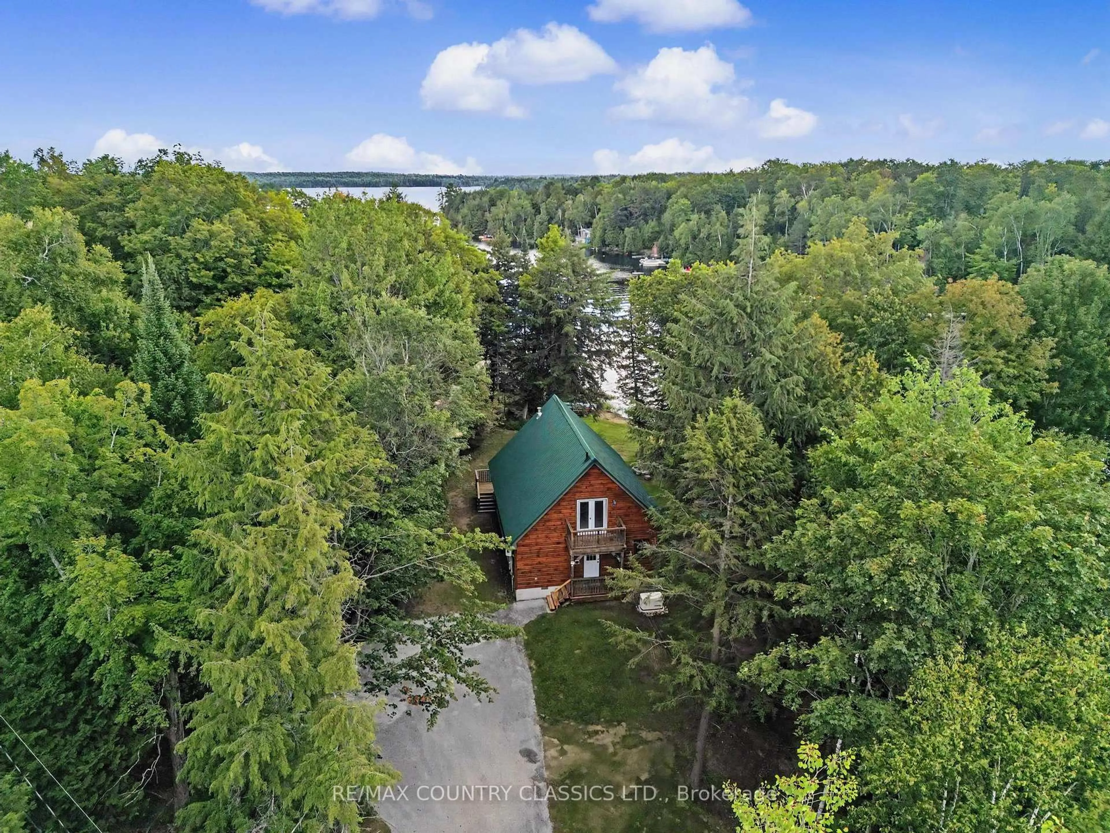 A pic from outside/outdoor area/front of a property/back of a property/a pic from drone, water/lake/river/ocean view for 203 Doc Evans Rd, North Kawartha Ontario K0L 1A0