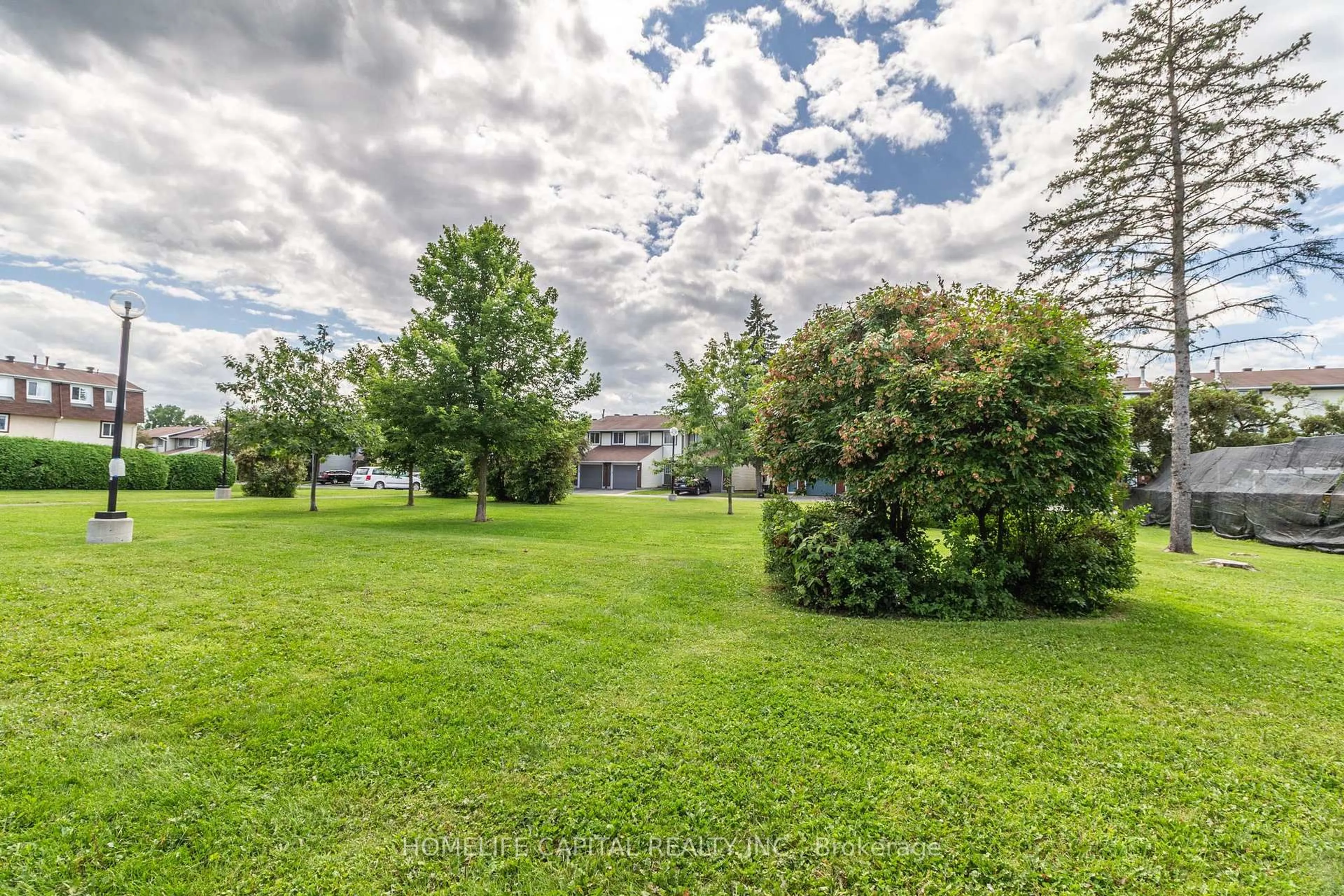 A pic from outside/outdoor area/front of a property/back of a property/a pic from drone, water/lake/river/ocean view for 1949 Greenway Park Lane, Ottawa Ontario K1B 5A9