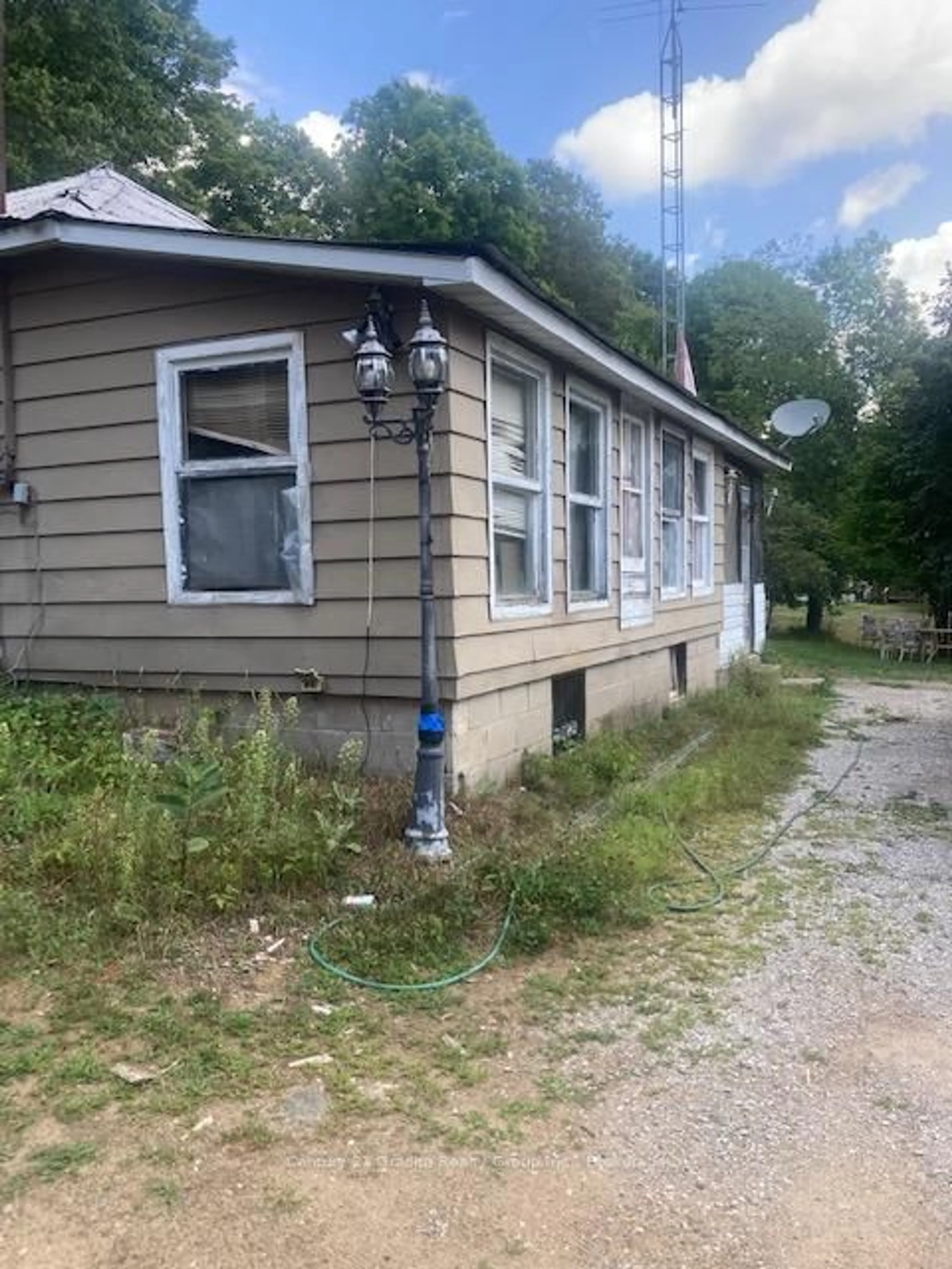 Home with vinyl exterior material, street for 2445 North Shore Rd, Algonquin Highlands Ontario K0M 1S0