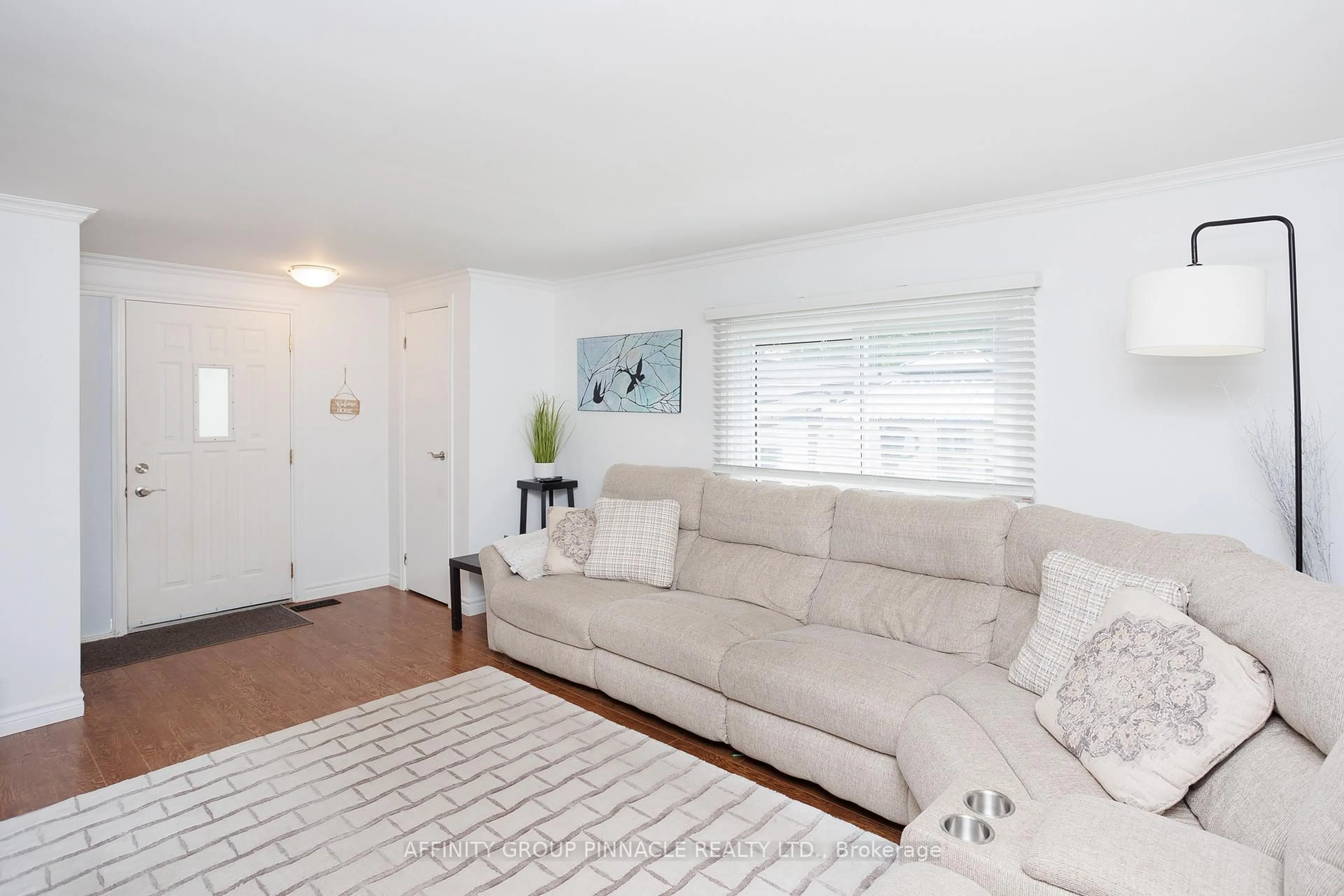 Living room with furniture, wood/laminate floor for 24 Circle Dr, Kawartha Lakes Ontario K9V 0H7