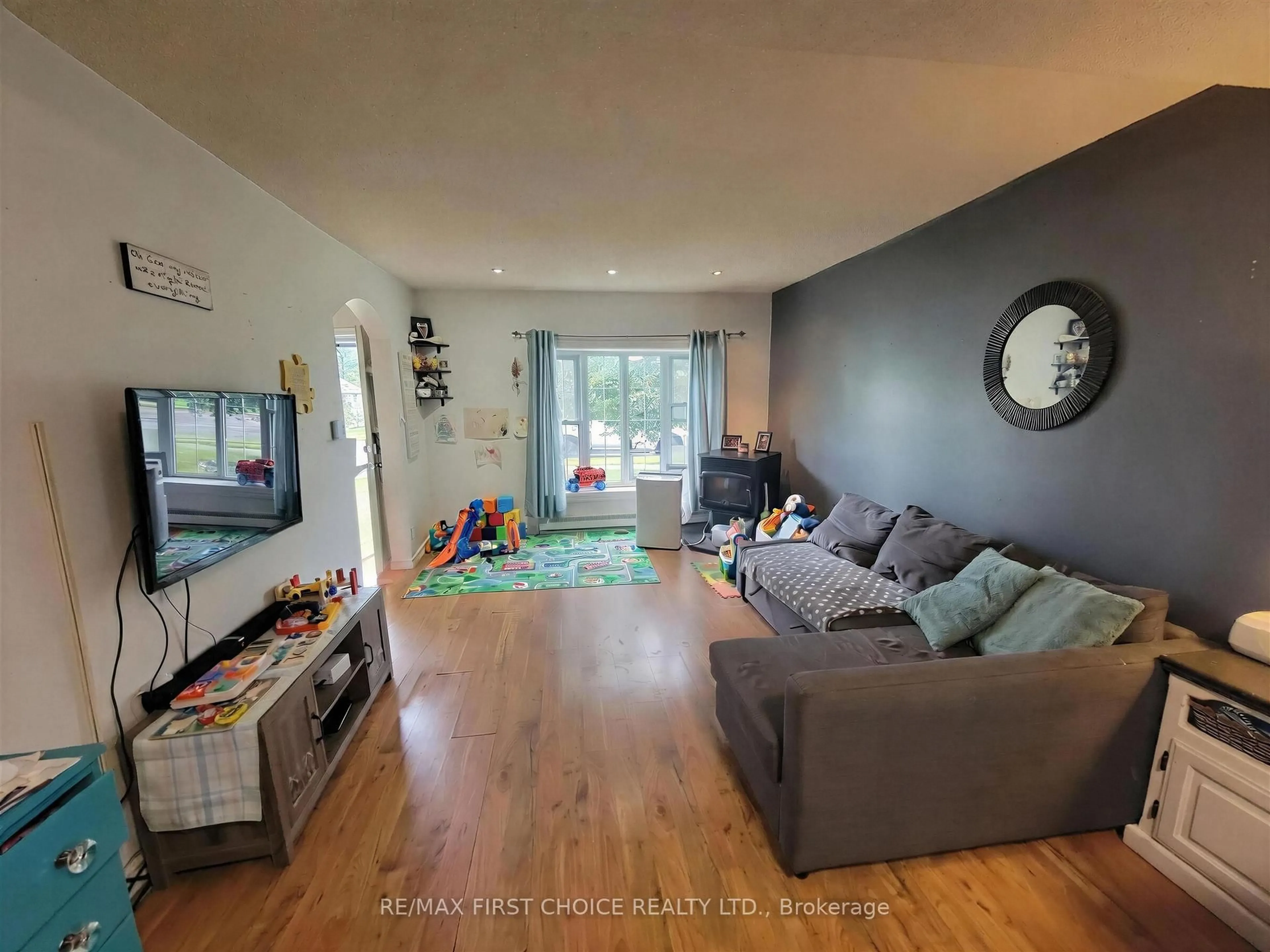 Living room with furniture, wood/laminate floor for 1032 Third St E, Fort Frances Ontario P9A 1S4