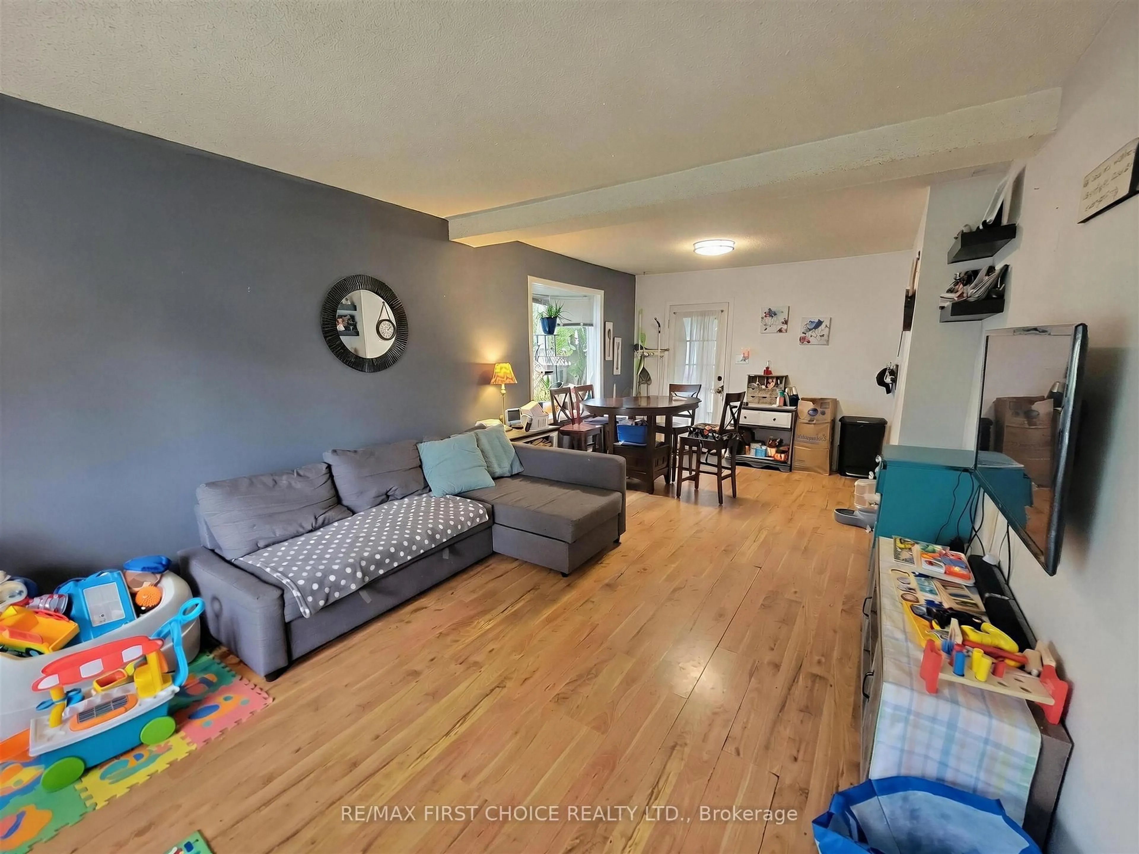 Living room with furniture, wood/laminate floor for 1032 Third St E, Fort Frances Ontario P9A 1S4