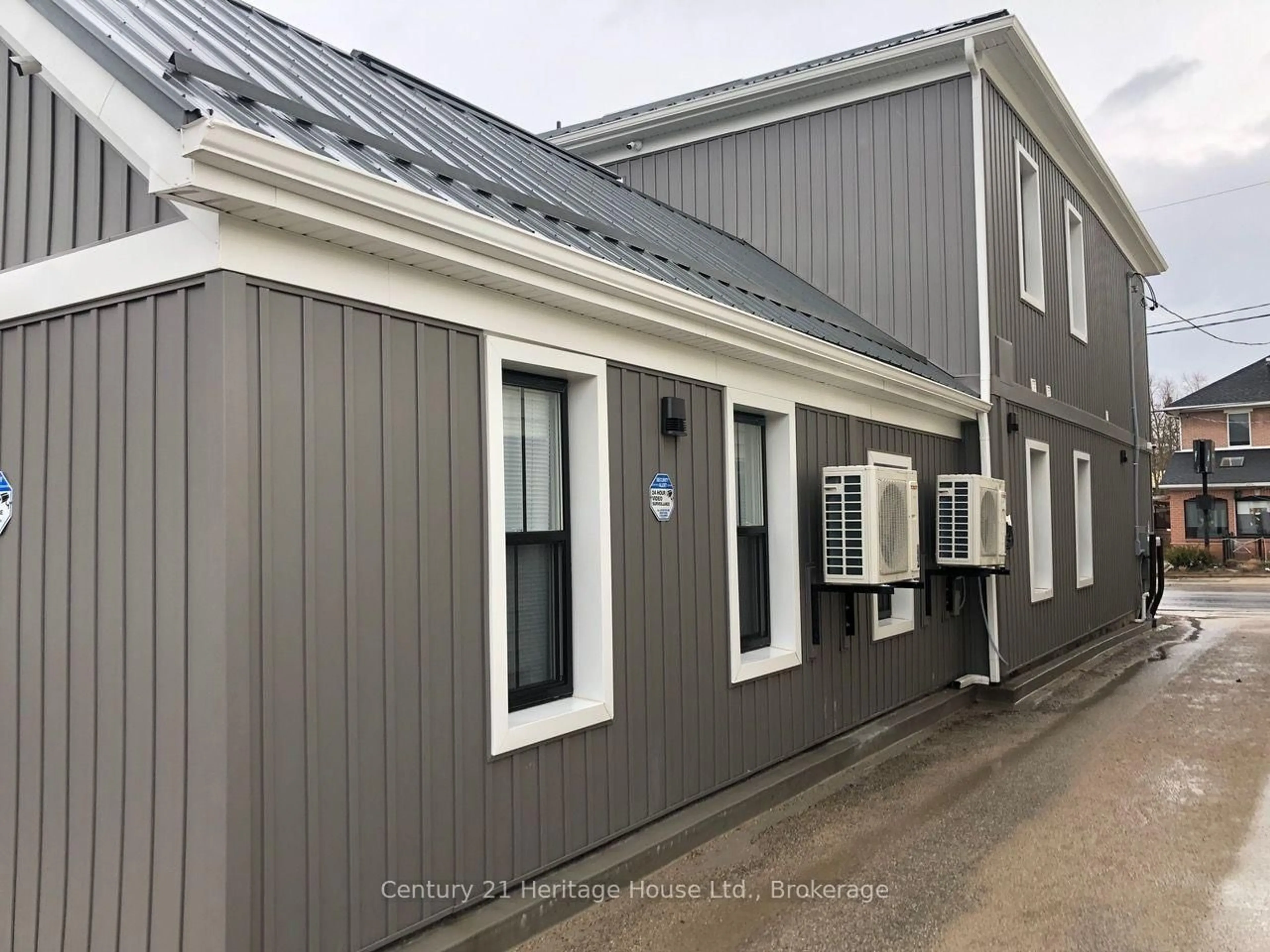 Home with vinyl exterior material, building for 239-249 Main St, Wellington North Ontario N0G 2L1