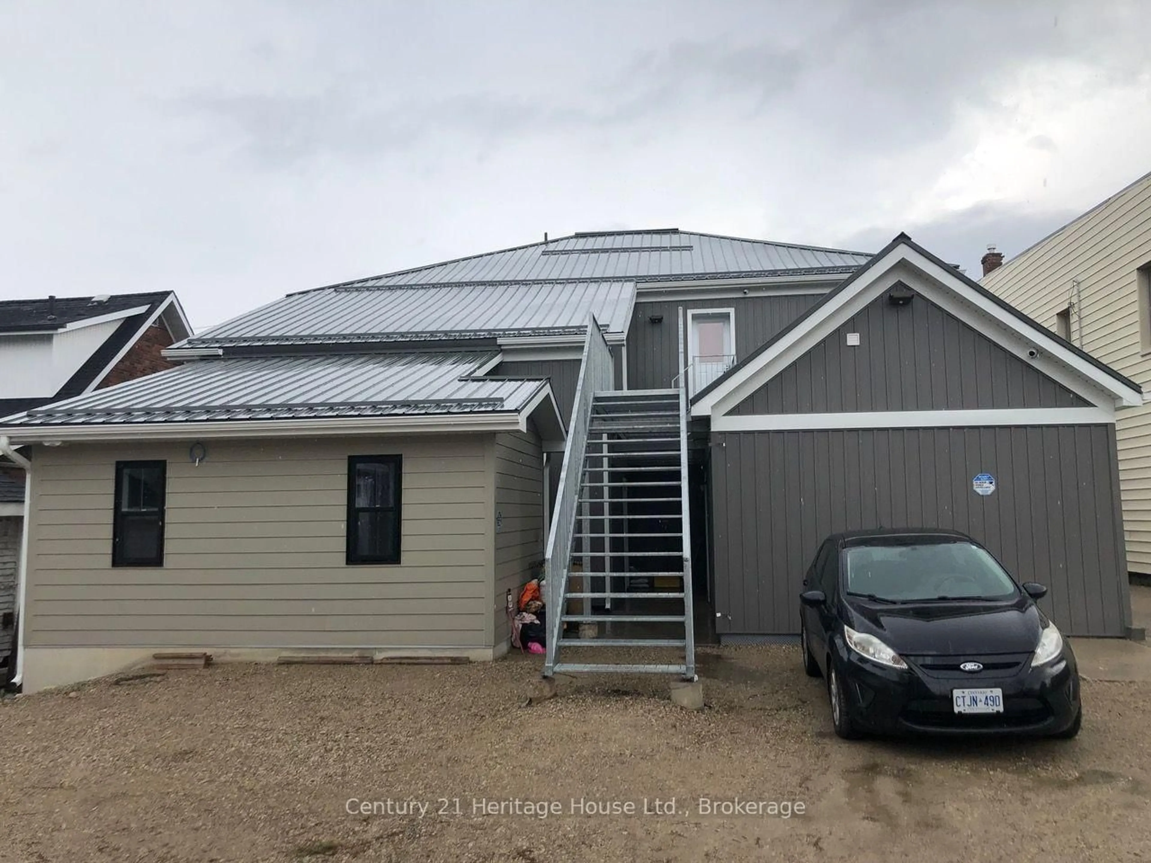 Home with vinyl exterior material, building for 239-249 Main St, Wellington North Ontario N0G 2L1