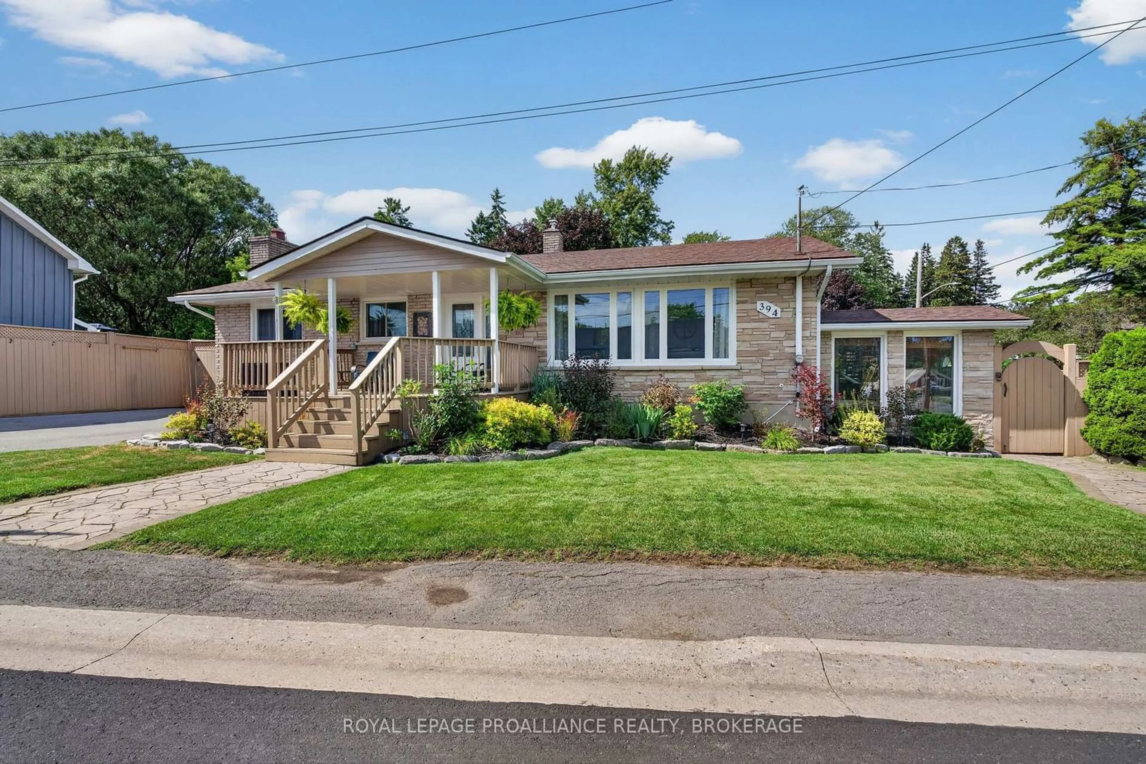 Home with vinyl exterior material, street for 394 Queen St, Bath Ontario K0H 1G0