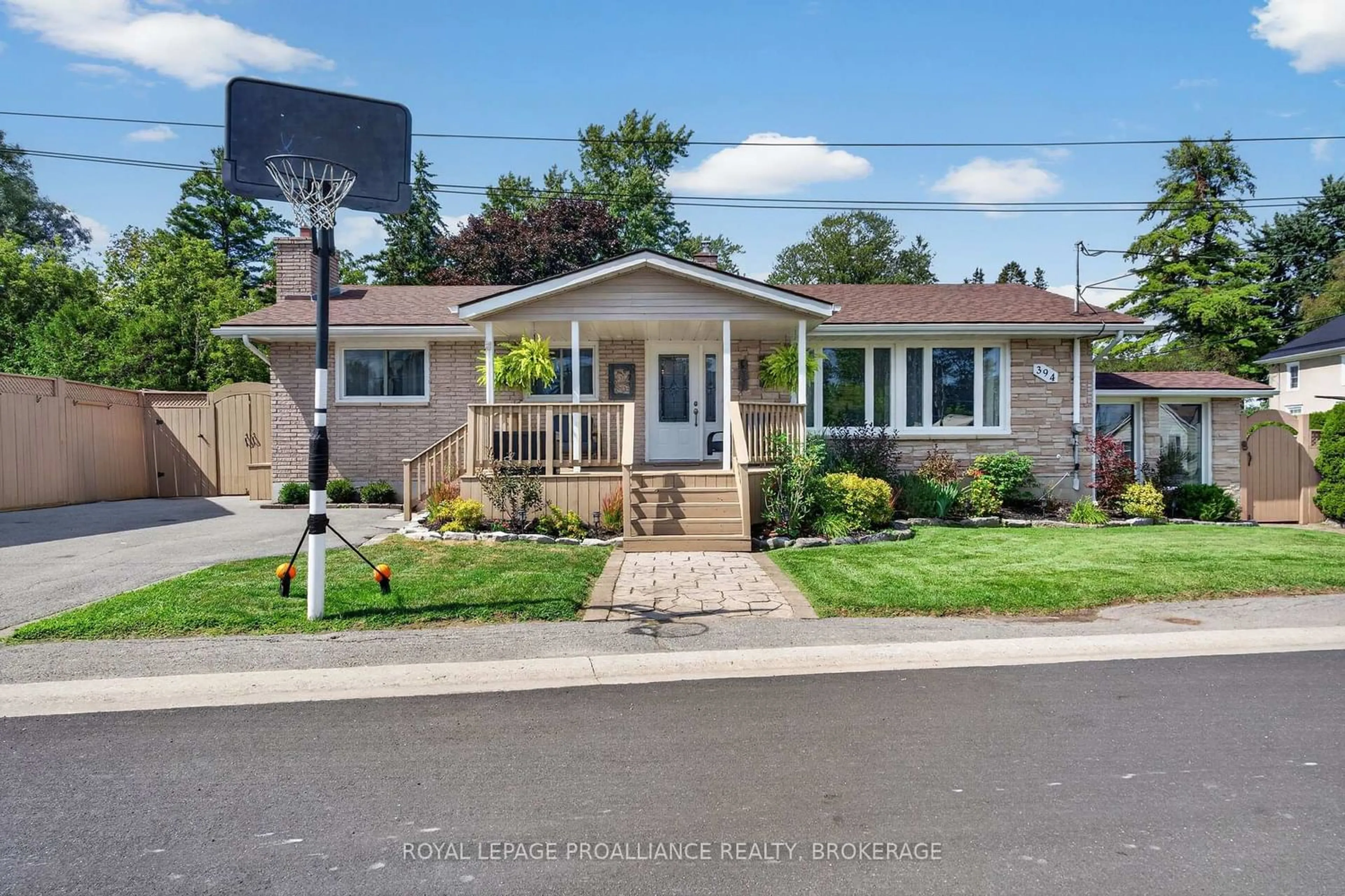 Home with vinyl exterior material, street for 394 Queen St, Bath Ontario K0H 1G0
