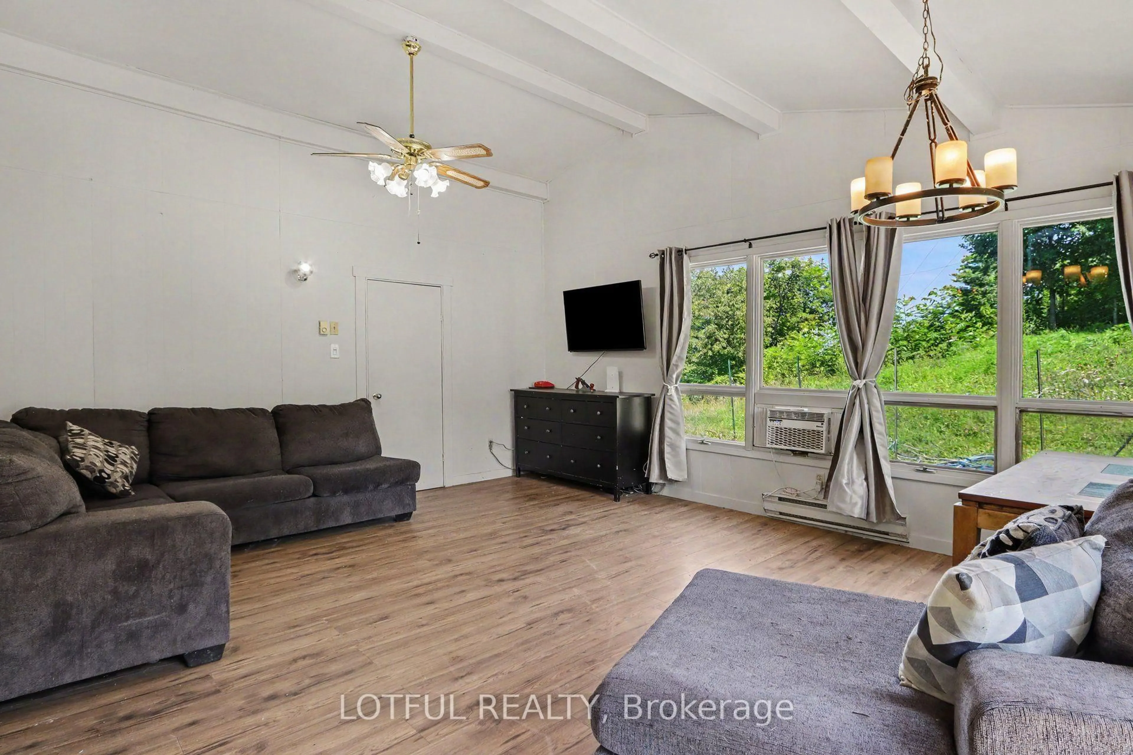 Living room with furniture, wood/laminate floor for 101 Maberly Station Rd, Maberly Ontario K0H 2B0