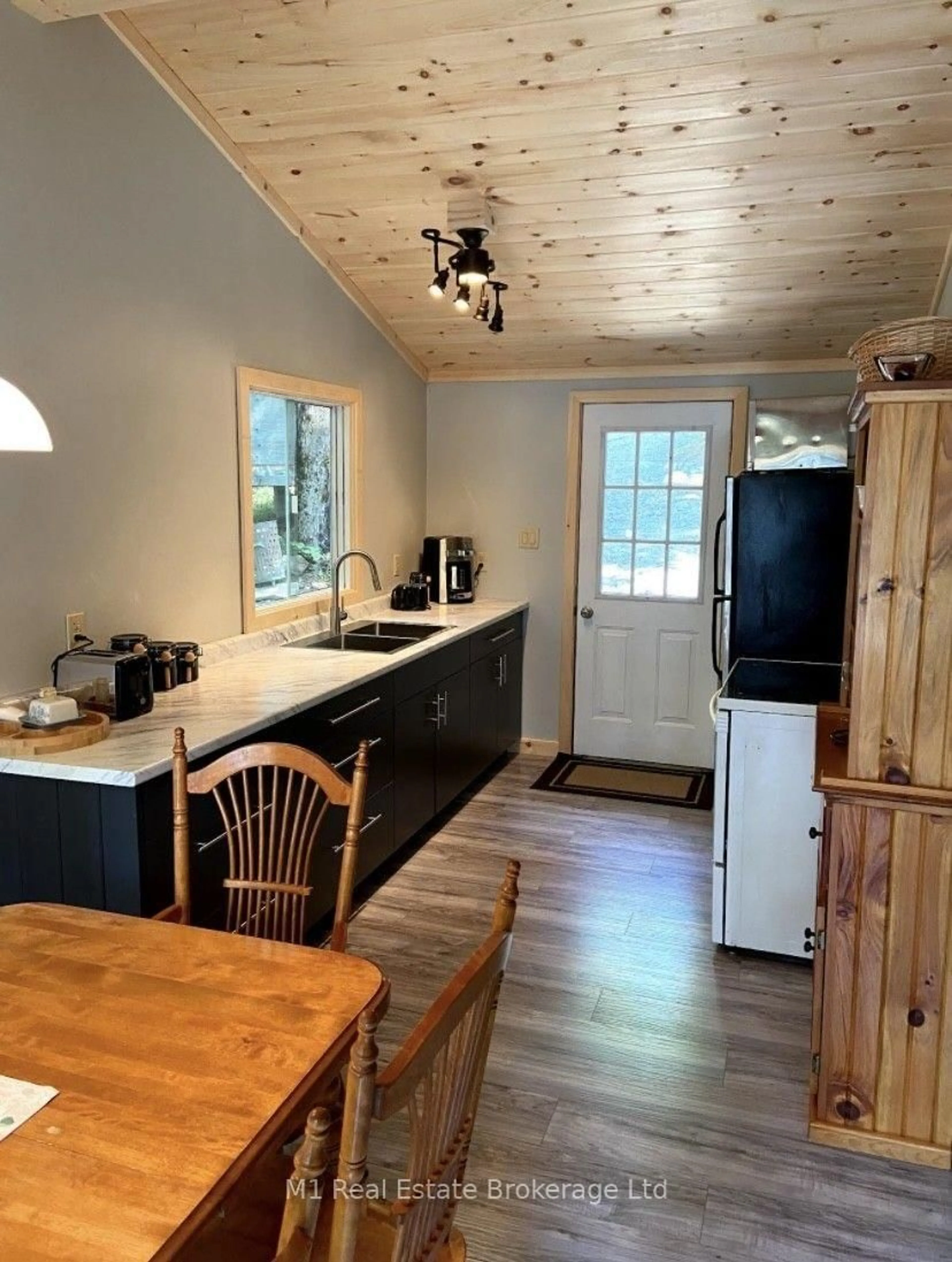 Open concept kitchen, wood/laminate floor for 2322 Wilkinson Rd, Dysart et al Ontario K0M 1S0