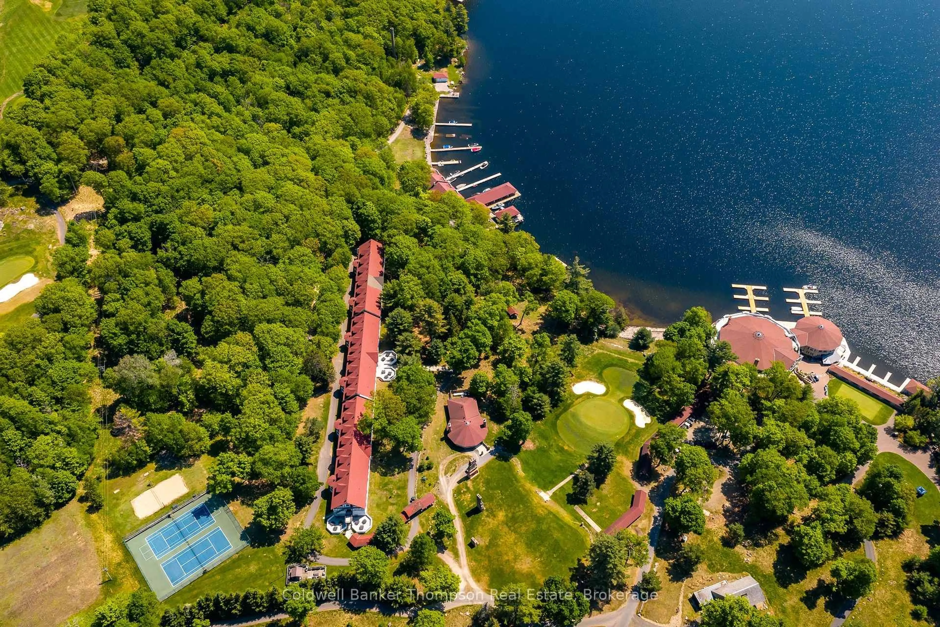A pic from outside/outdoor area/front of a property/back of a property/a pic from drone, water/lake/river/ocean view for 12 Bigwin Island #307, Lake of Bays Ontario P0B 1A0