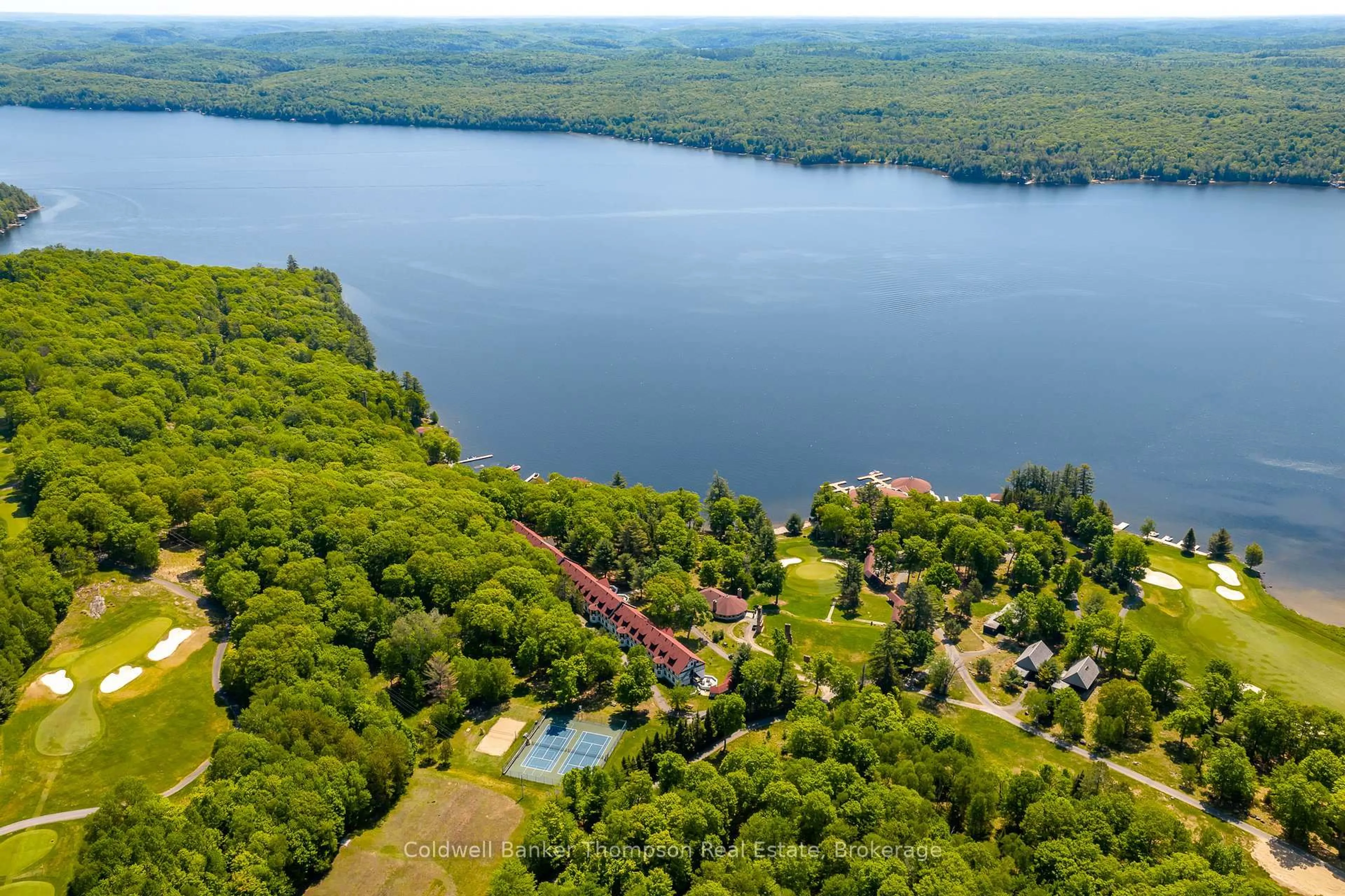 A pic from outside/outdoor area/front of a property/back of a property/a pic from drone, water/lake/river/ocean view for 12 Bigwin Island #307, Lake of Bays Ontario P0B 1A0