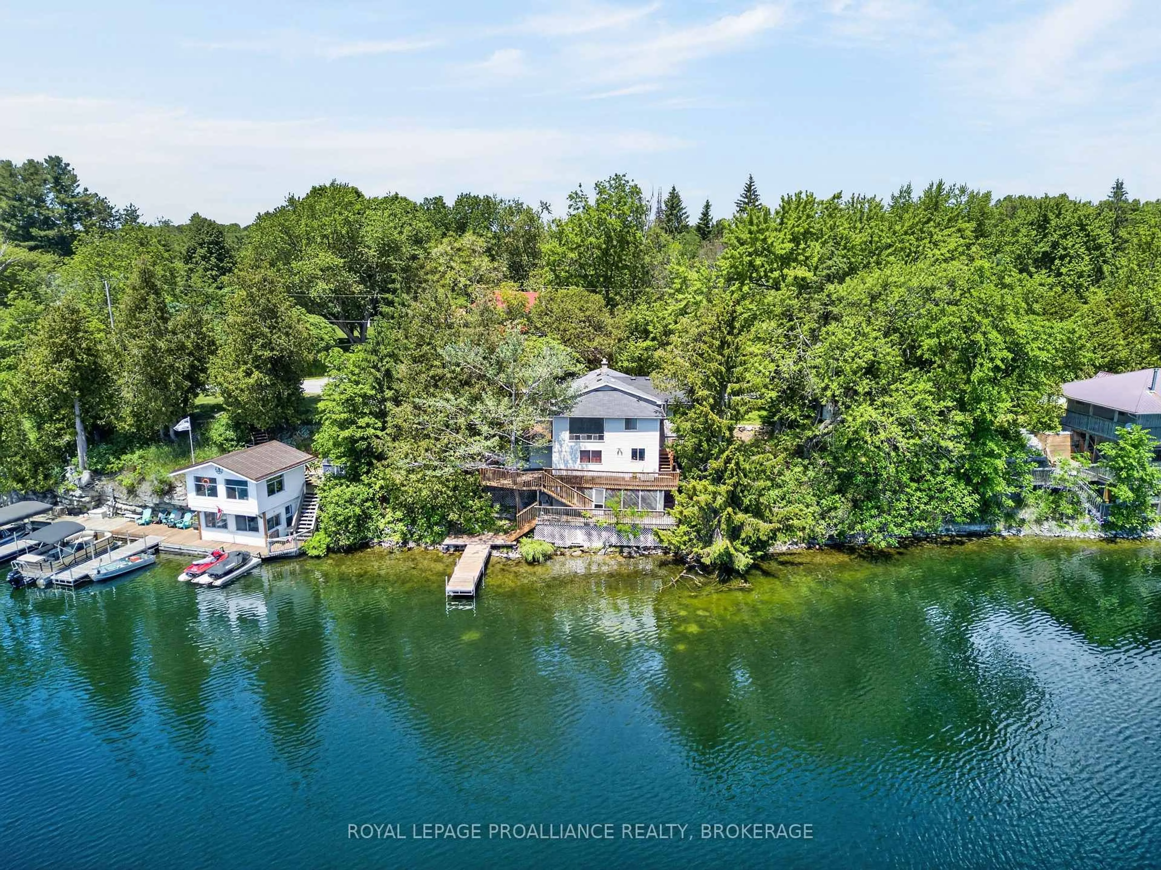 A pic from outside/outdoor area/front of a property/back of a property/a pic from drone, water/lake/river/ocean view for 4670 Clearwater Rd, Sydenham Ontario K0H 2T0