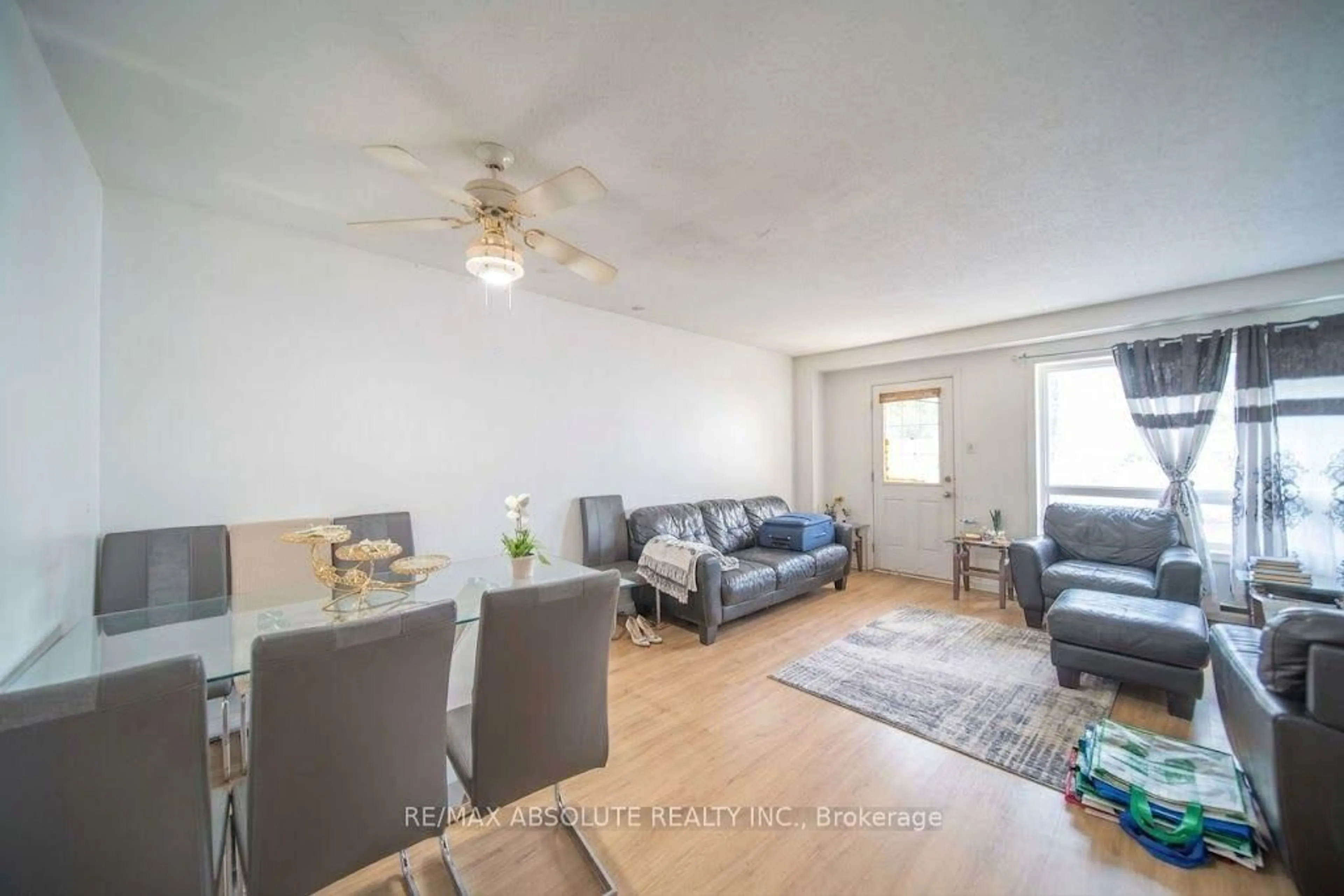 Living room with furniture, wood/laminate floor for 30 E Sonnet Cres, Ottawa Ontario K2H 8W8