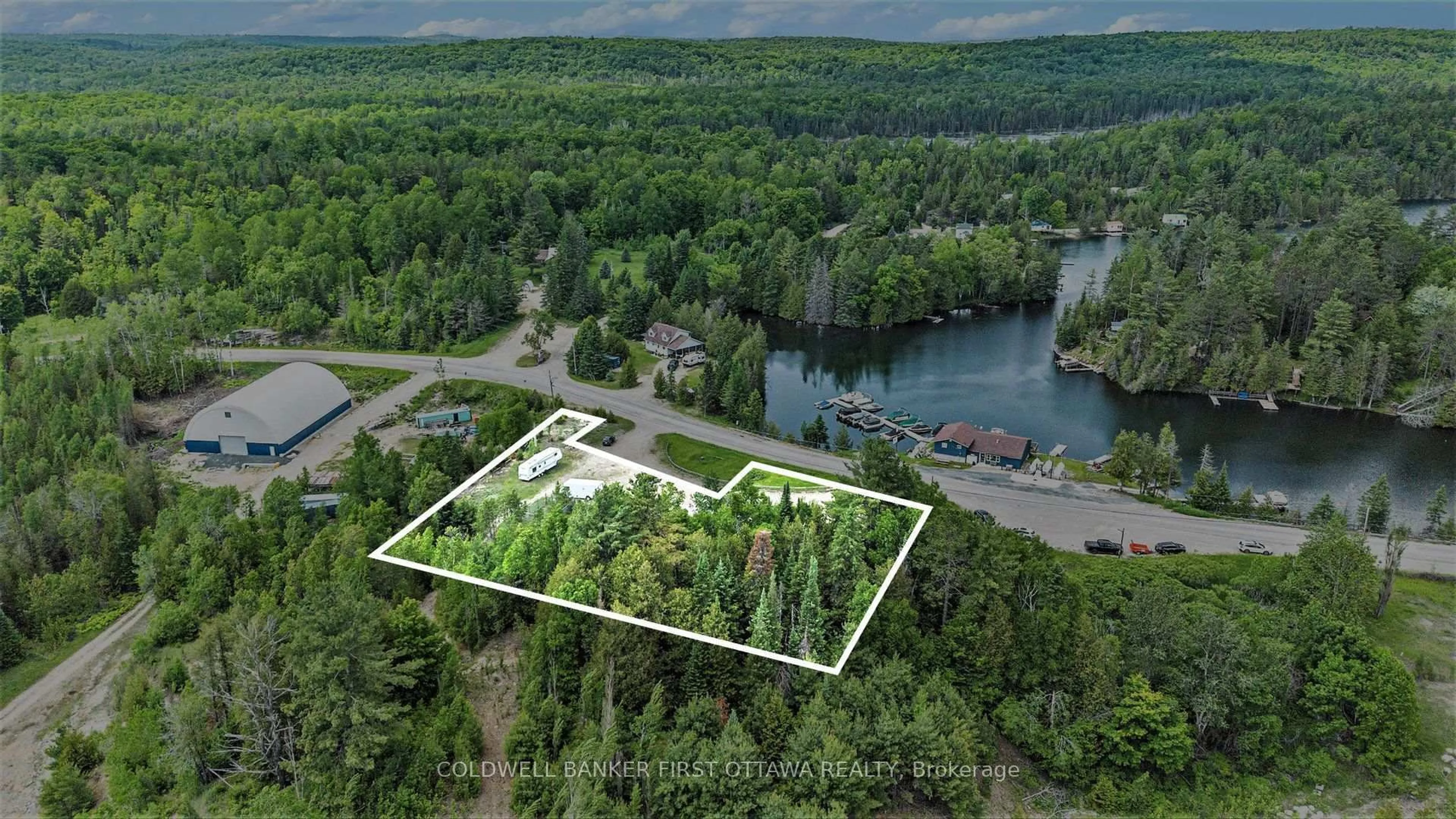 A pic from outside/outdoor area/front of a property/back of a property/a pic from drone, water/lake/river/ocean view for 9628 HWY 509, Ompah Ontario K0H 2J0