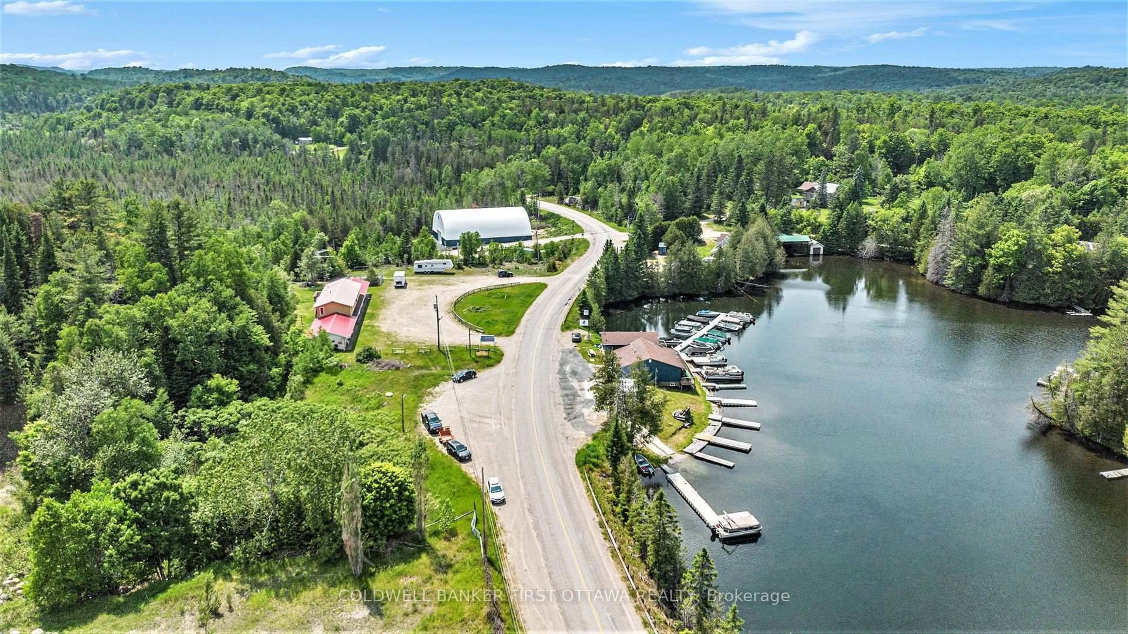 A pic from outside/outdoor area/front of a property/back of a property/a pic from drone, water/lake/river/ocean view for 9628 HWY 509, Ompah Ontario K0H 2J0