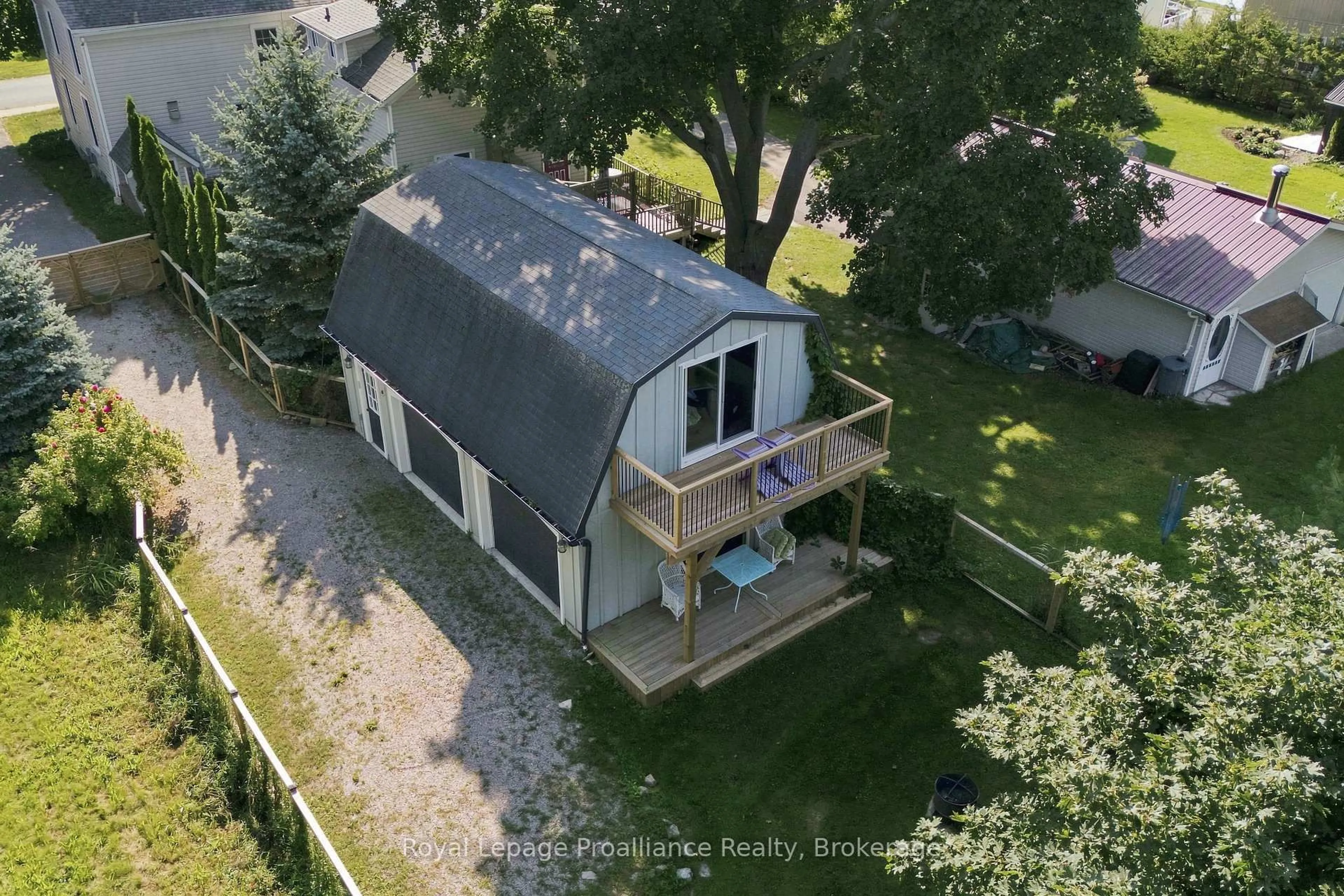 A pic from outside/outdoor area/front of a property/back of a property/a pic from drone, unknown for 28 West St, Prince Edward County Ontario K0K 3L0