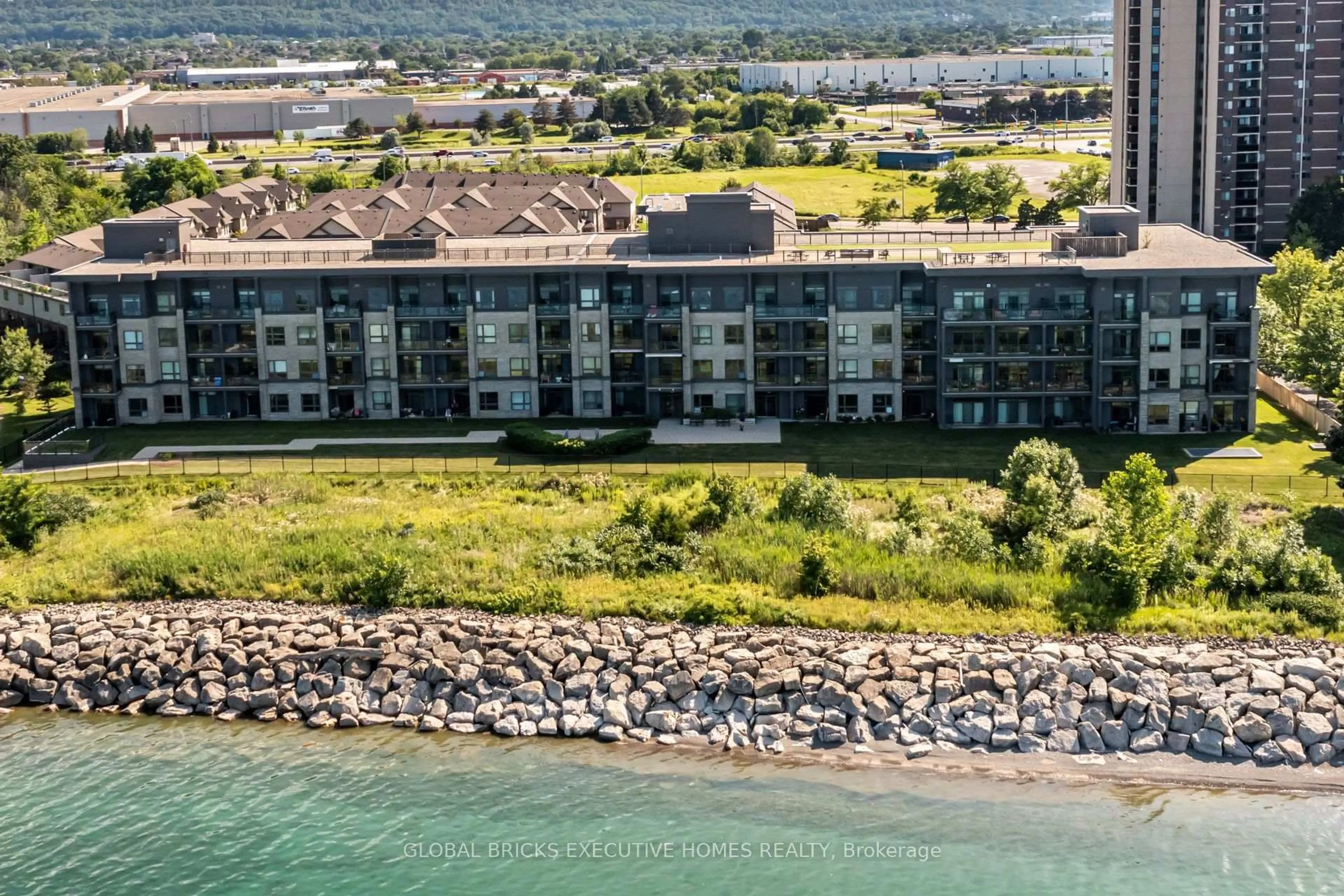 A pic from outside/outdoor area/front of a property/back of a property/a pic from drone, water/lake/river/ocean view for 35 Southshore Cres ##106, Hamilton Ontario L8E 0J2